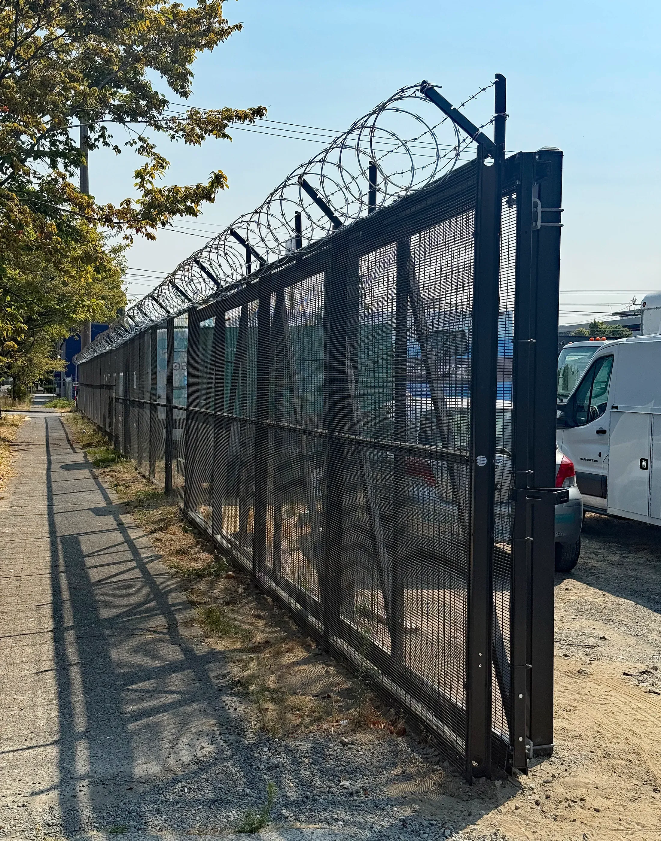 cantilever gate installed by top rail fence