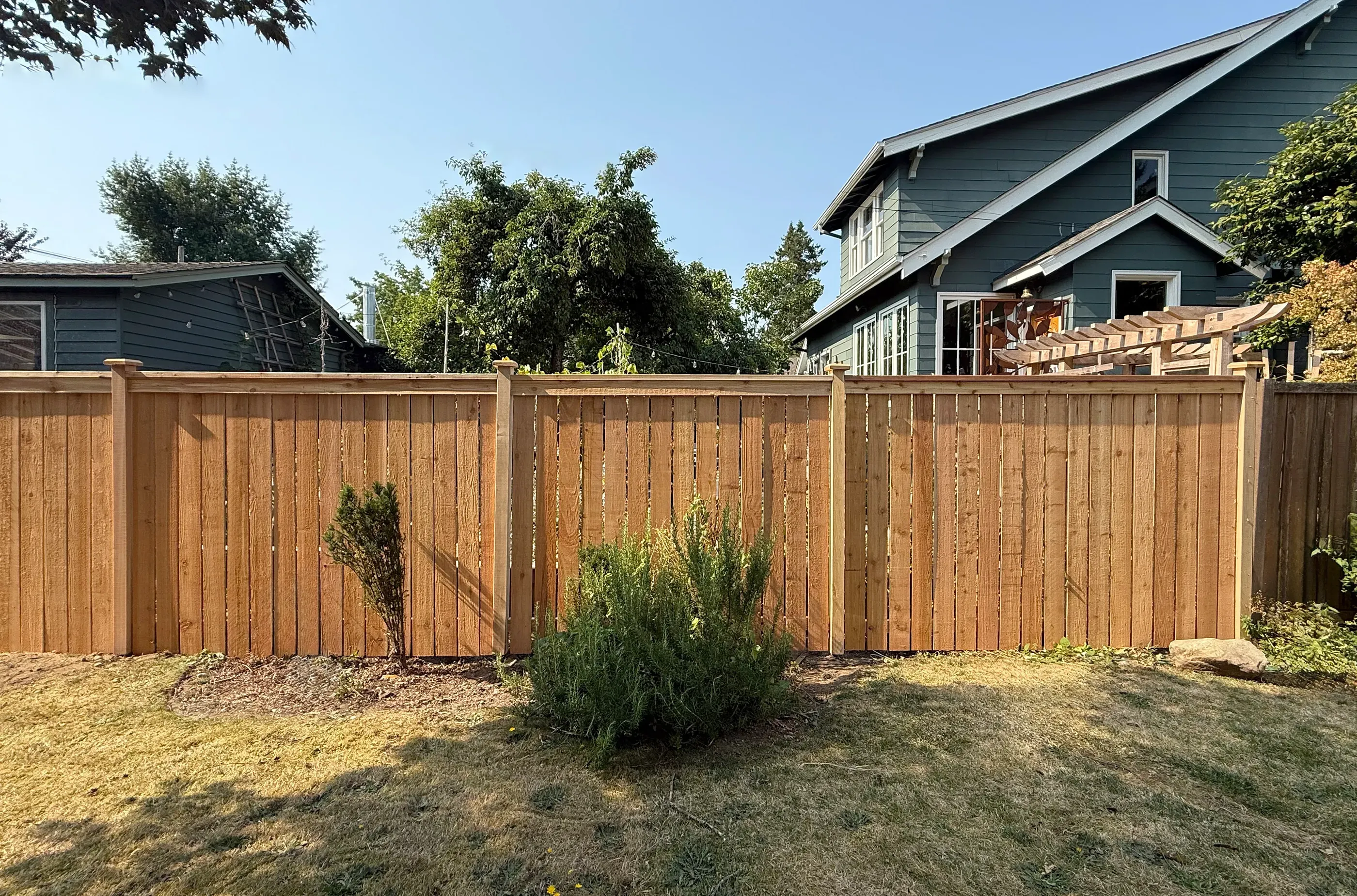 wood cap and trim fence installed by top rail fence