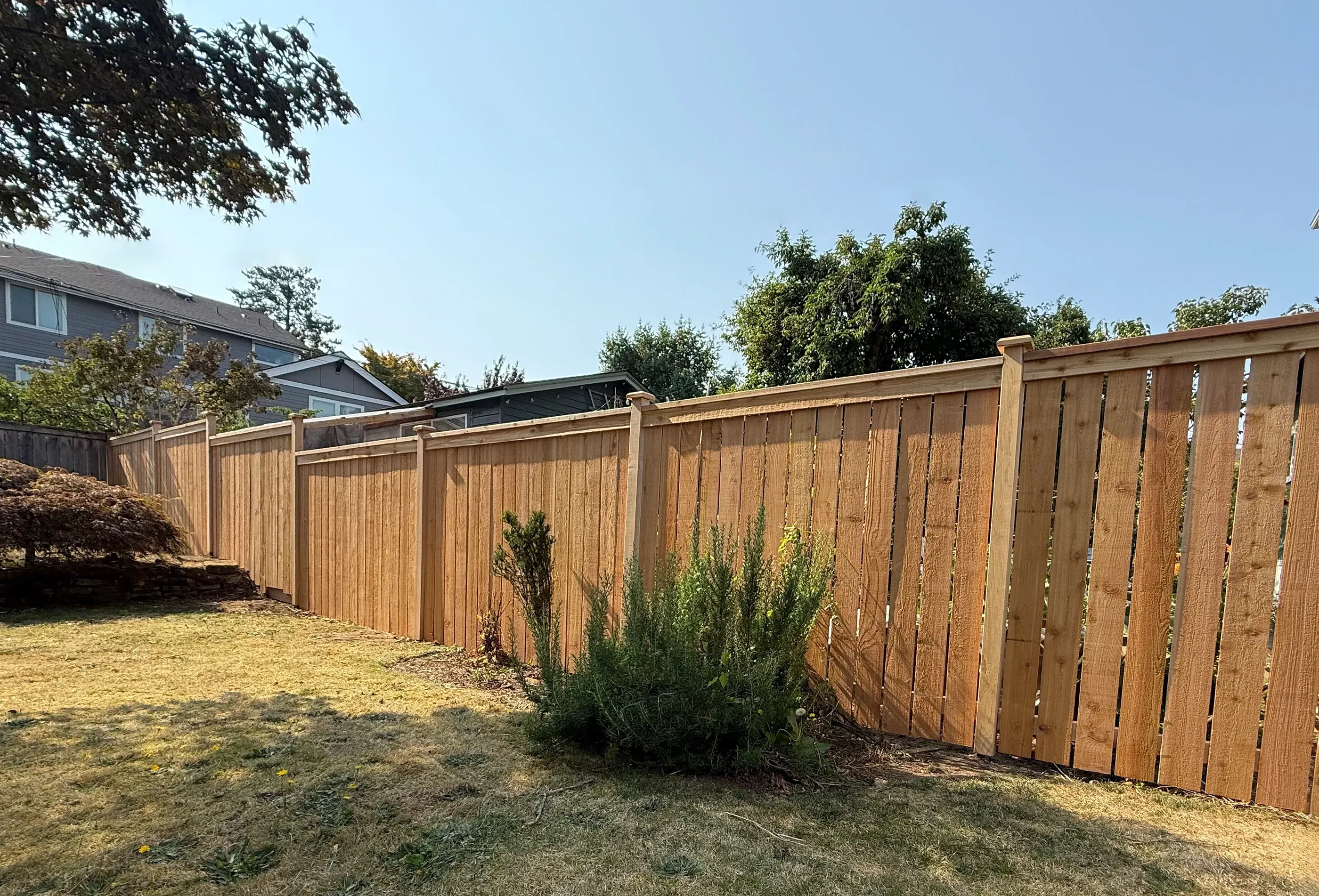 wood cap and trim fence installed by top rail fence