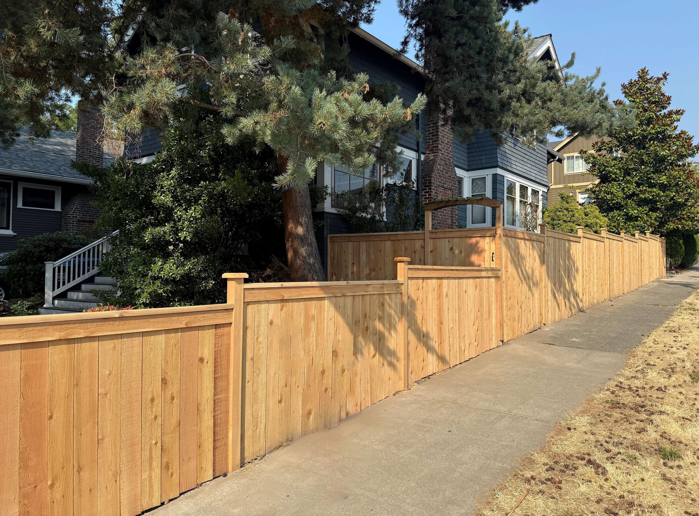 wood cap and trim fence installed by top rail fence