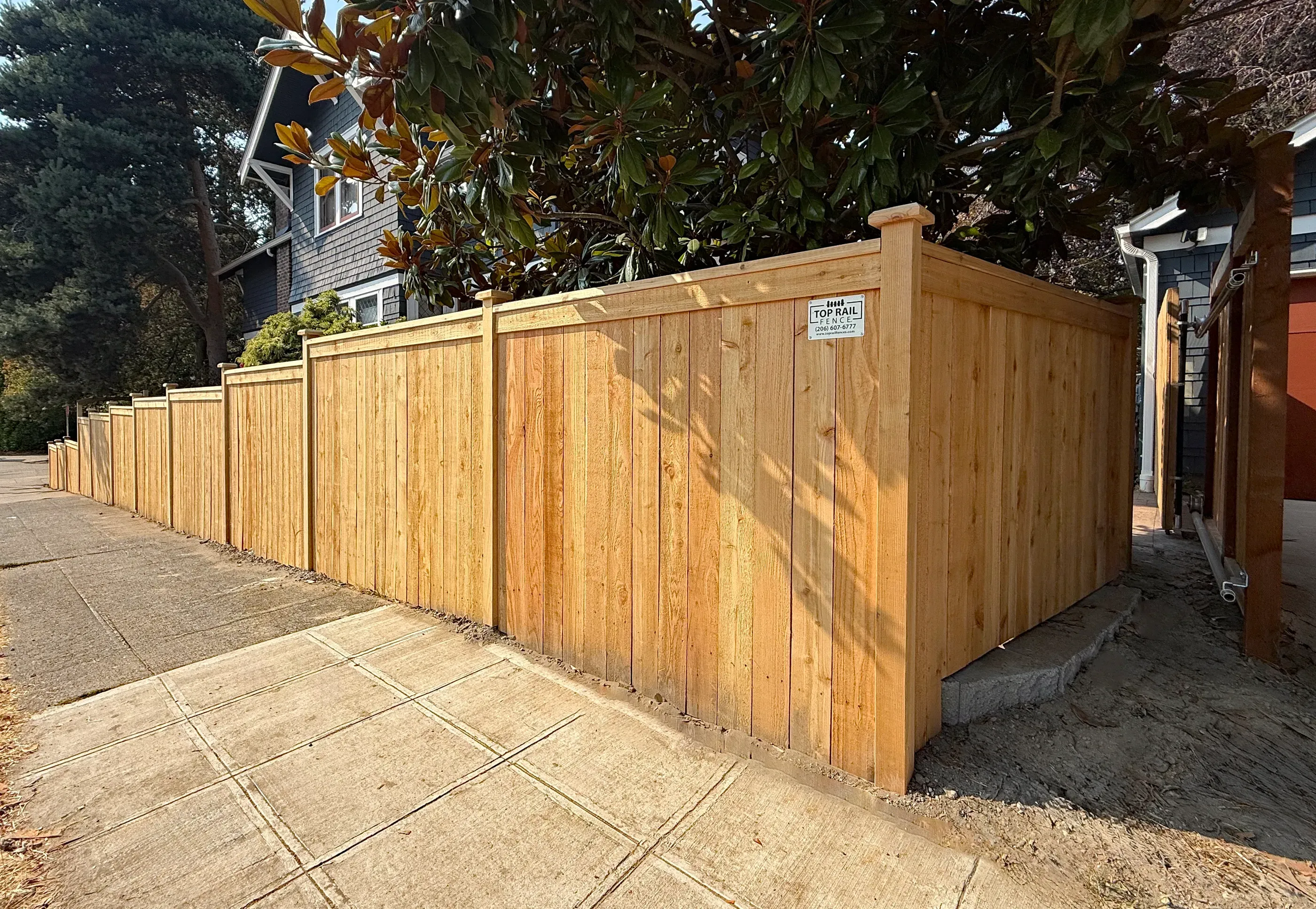 wood cap and trim fence installed by top rail fence