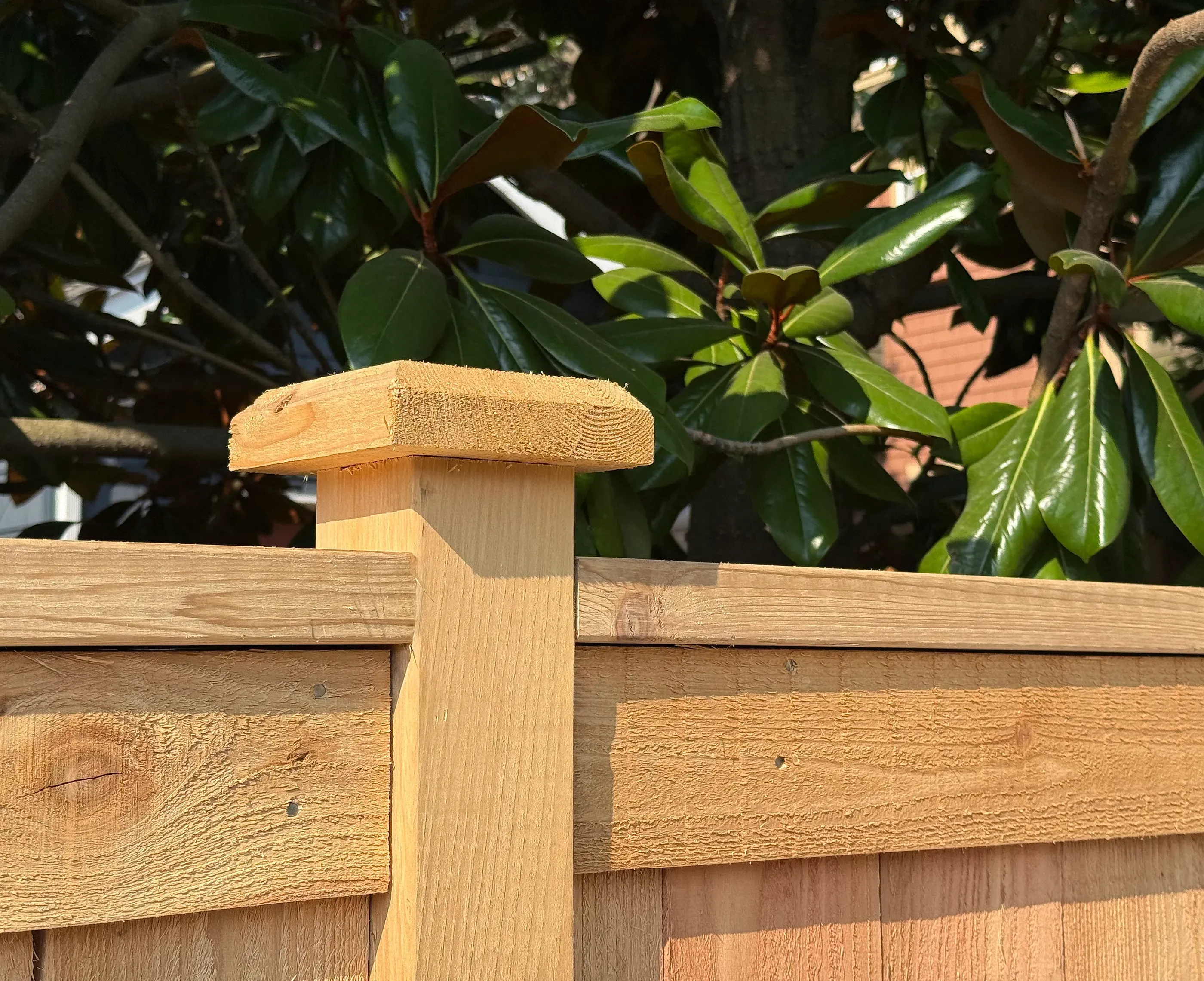 wood cap and trim fence installed by top rail fence
