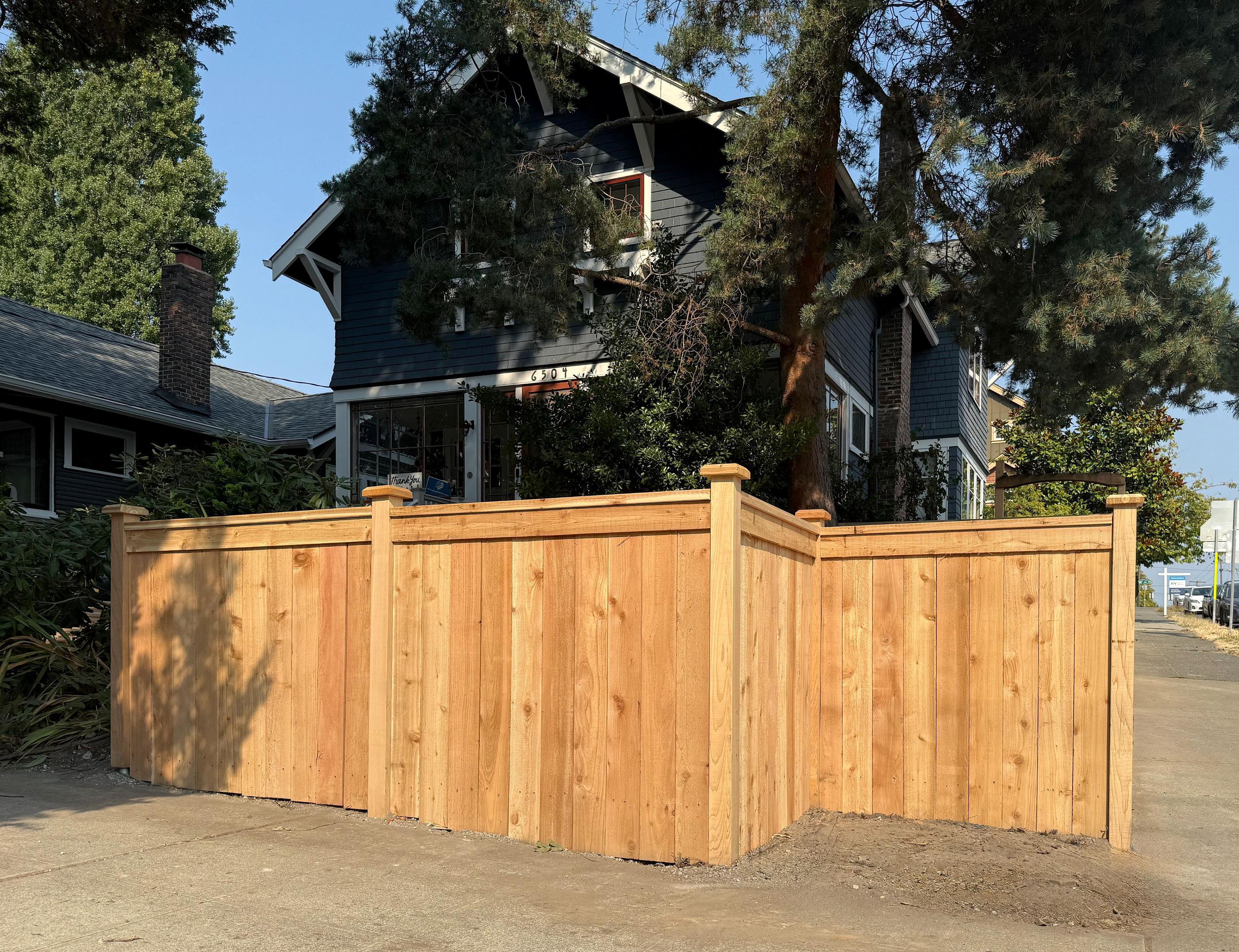 wood cap and trim fence installed by top rail fence