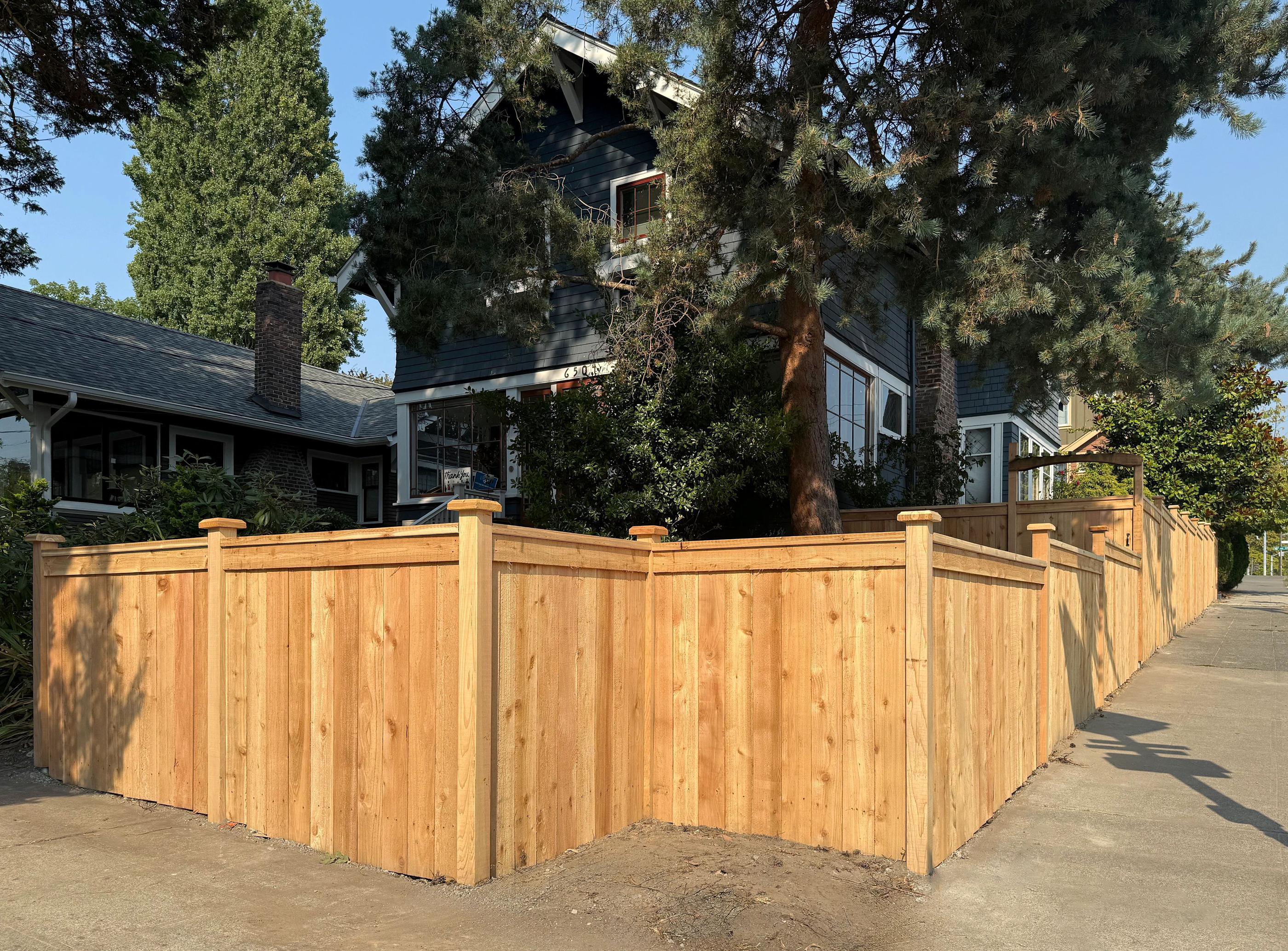 wood cap and trim fence installed by top rail fence