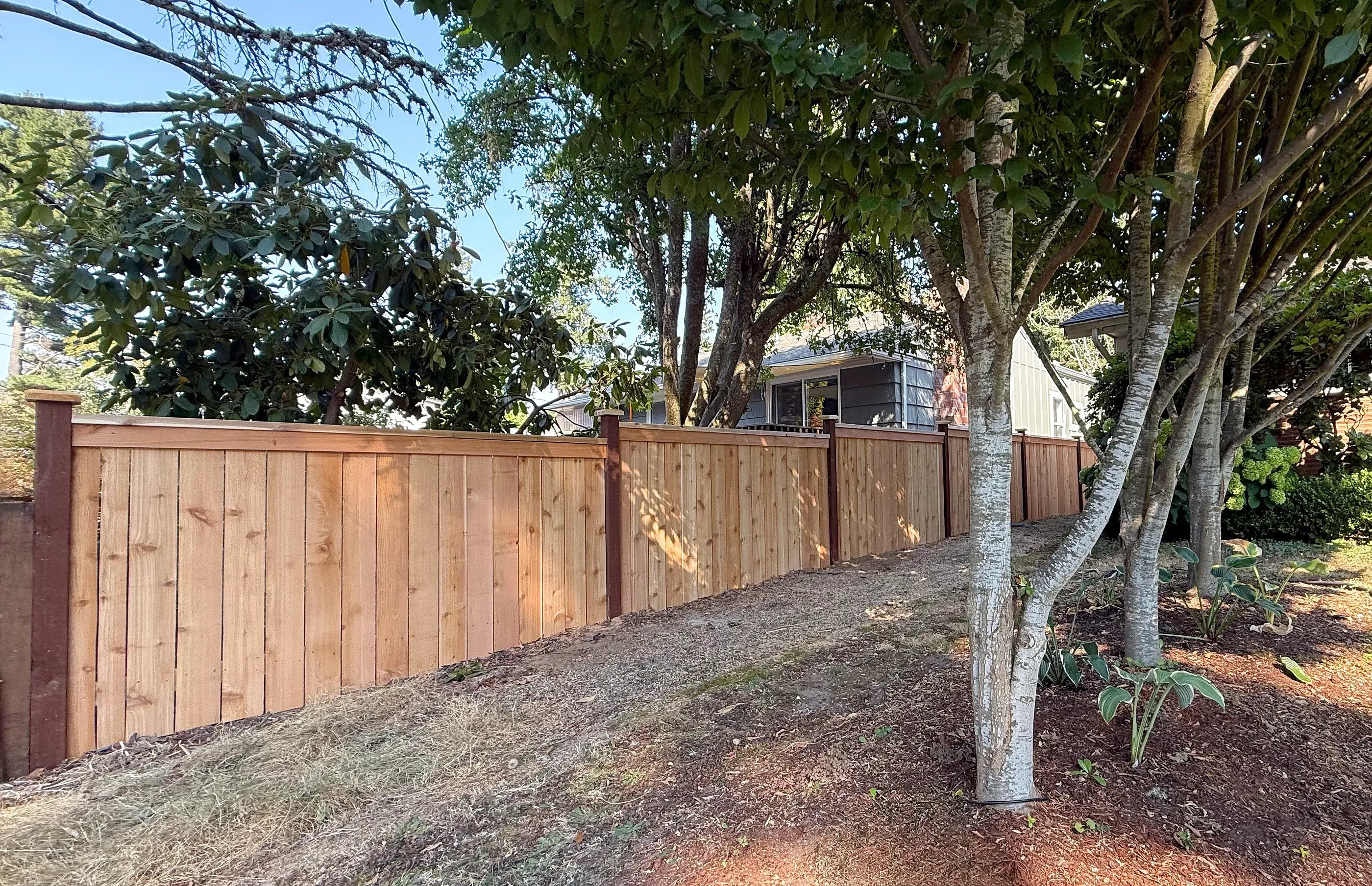 wood cap and trim fence installed by top rail fence