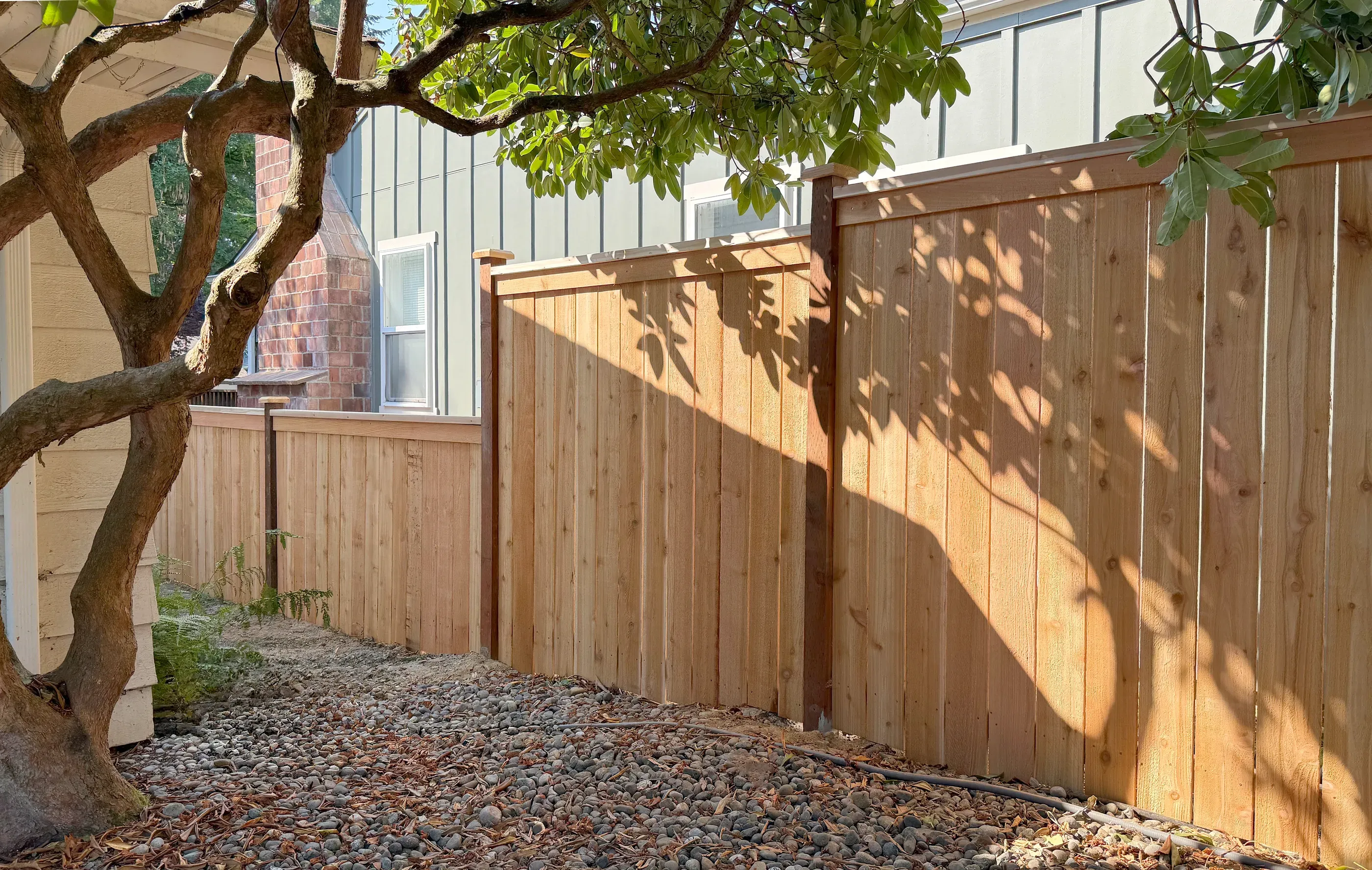 wood cap and trim fence installed by top rail fence