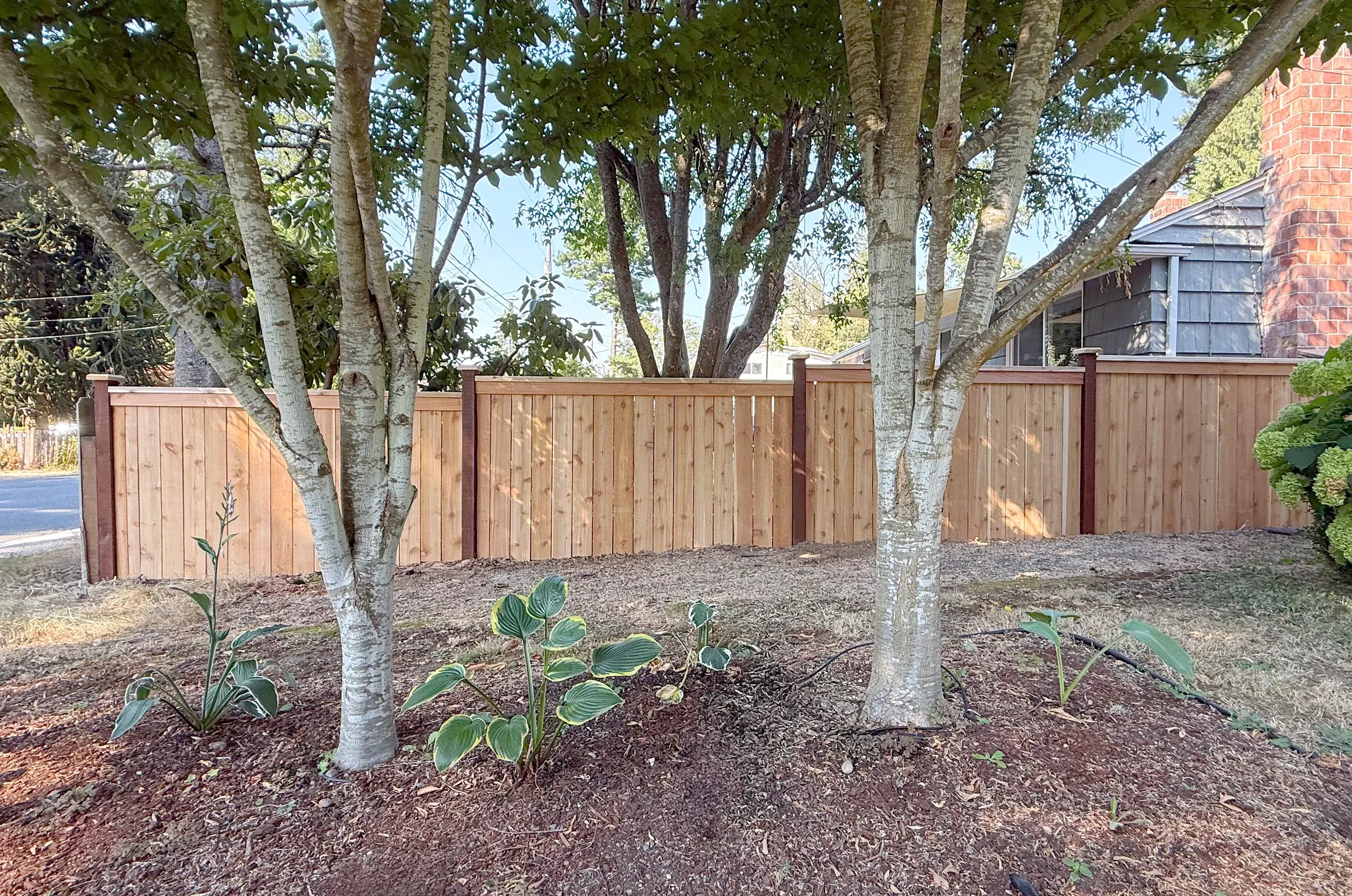 wood cap and trim fence installed by top rail fence