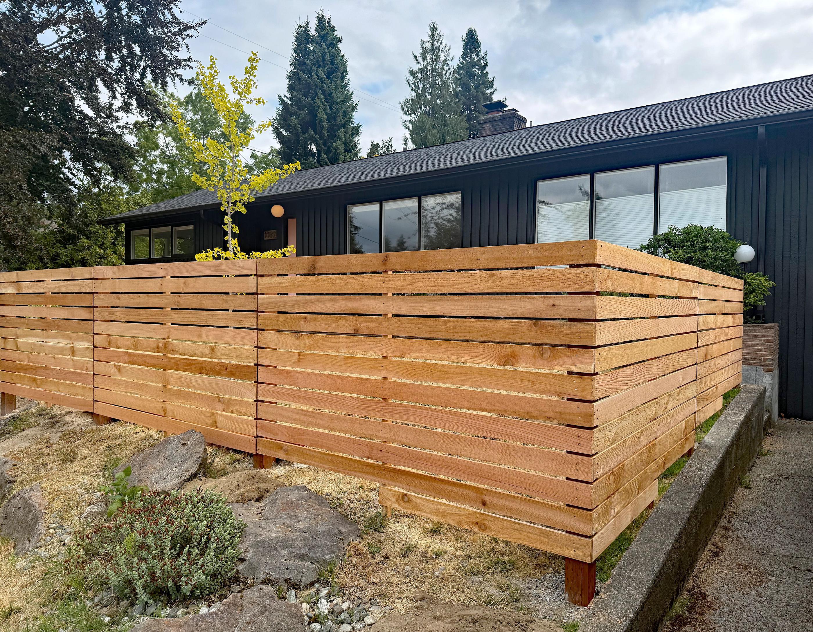 wood horizontal fence installed by top rail fence