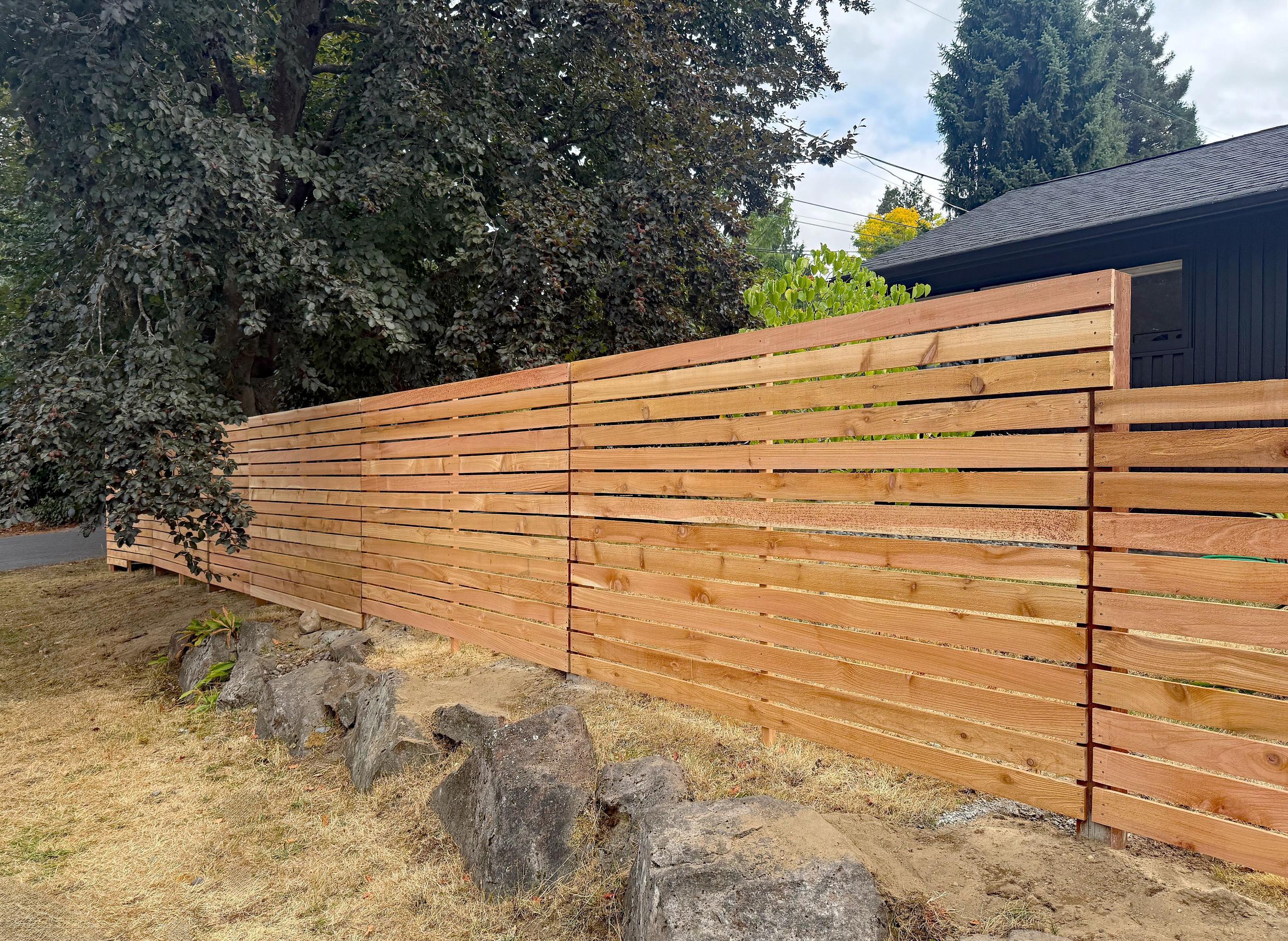 wood horizontal fence installed by top rail fence