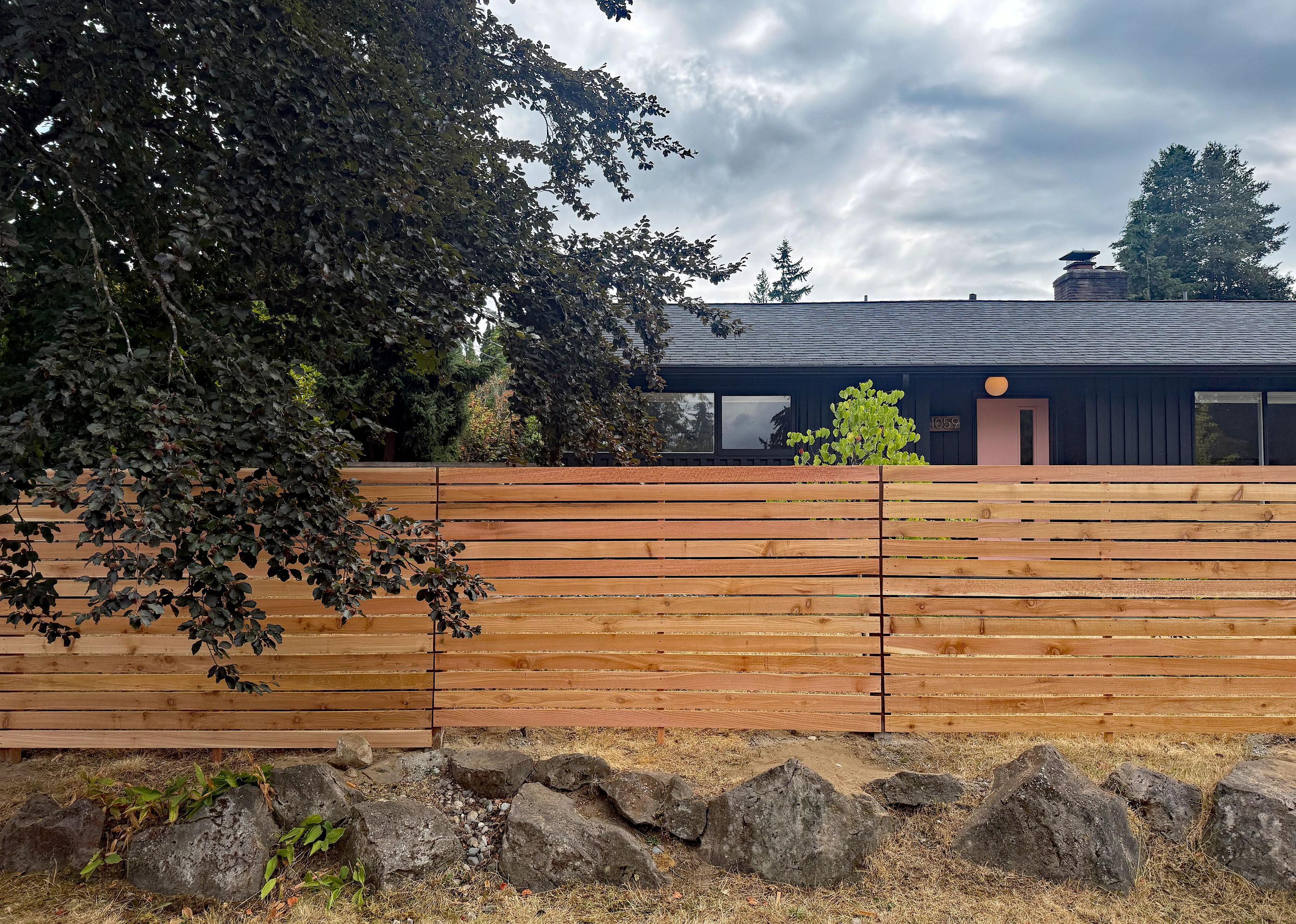wood horizontal fence installed by top rail fence