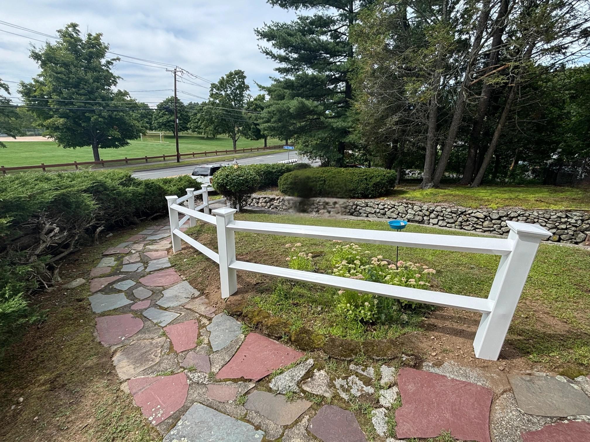 2 rail vinyl ranch rail fence installed by top rail fence