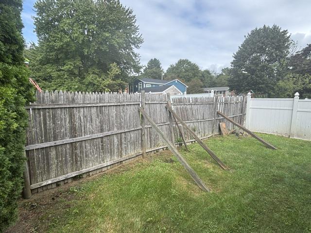 old stockade fence installed by top rail fence