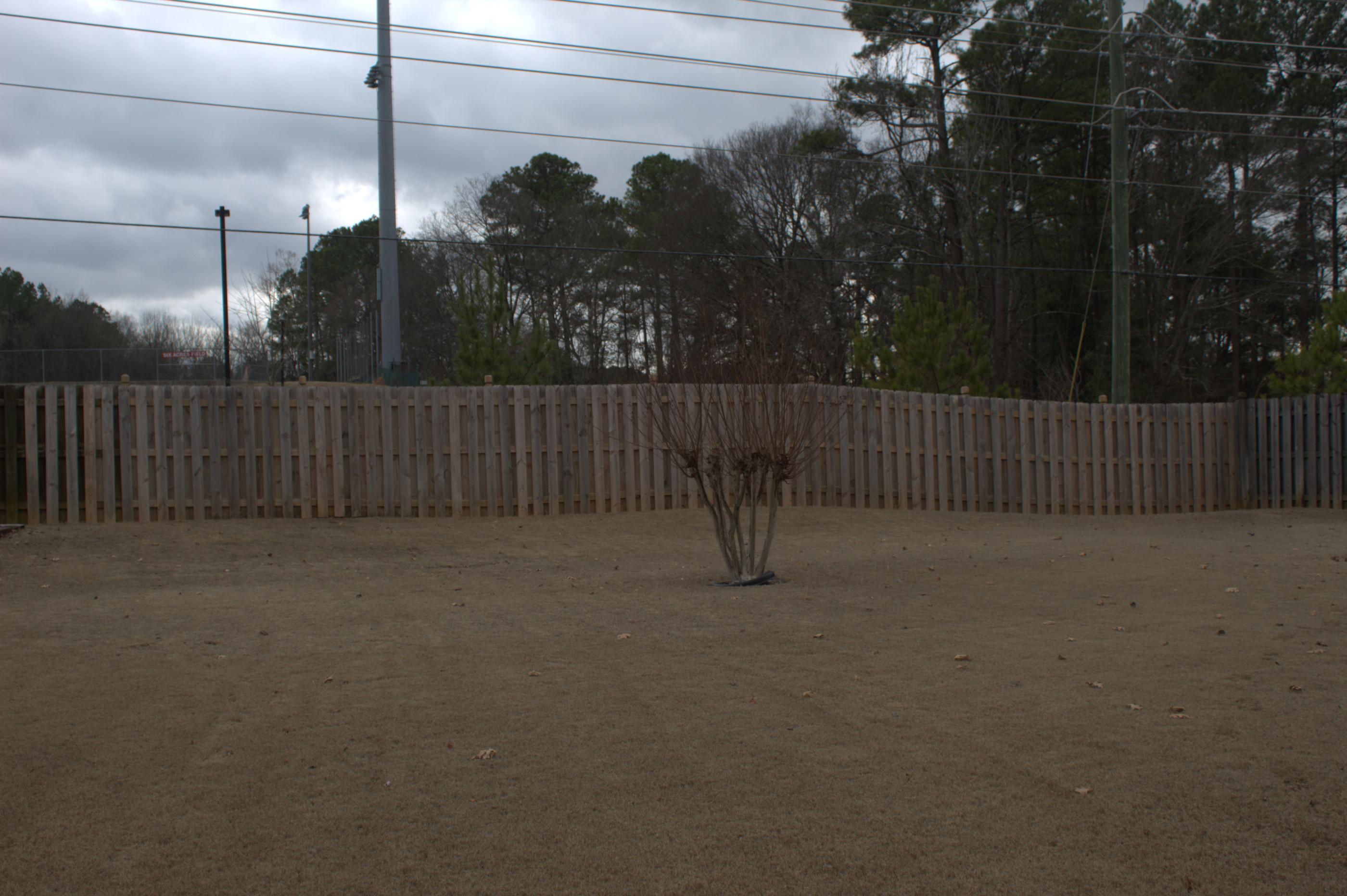 wood shadowbox fence installed by top rail fence