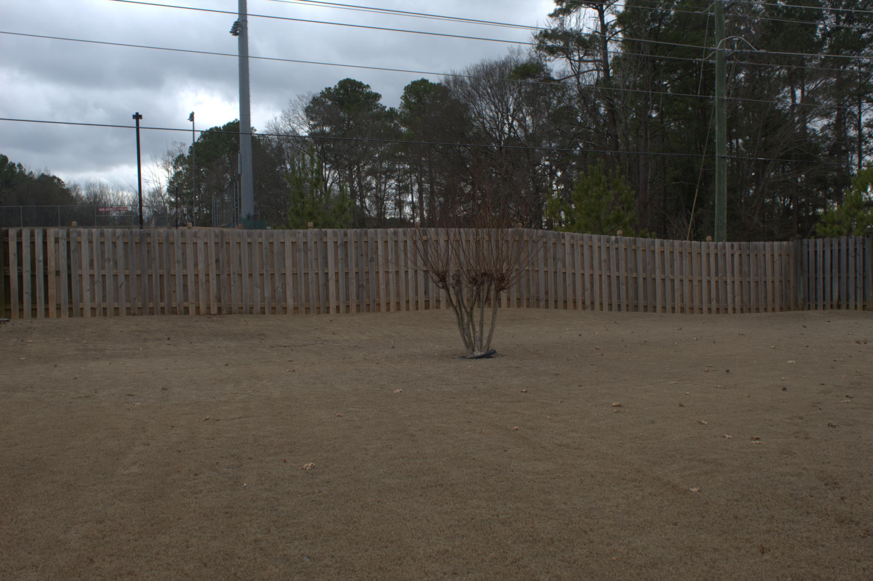 wood shadowbox fence installed by top rail fence