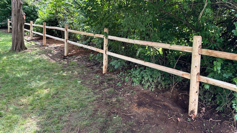 Cedar post and rail wooden fence project