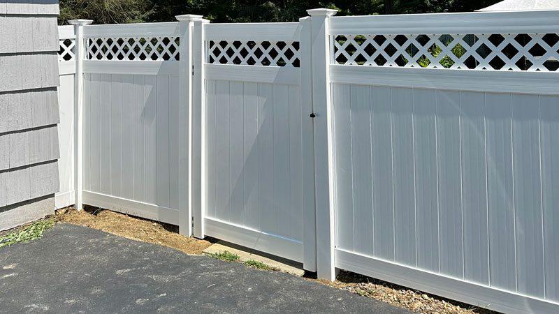 White vinyl privacy fence project with lattice top