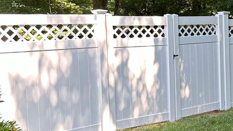 White vinyl privacy fence project with lattice top