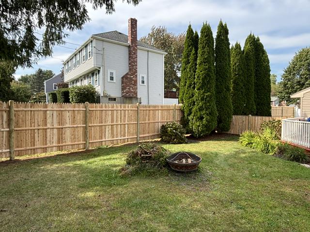 new wood stockade fence installed by top rail fence
