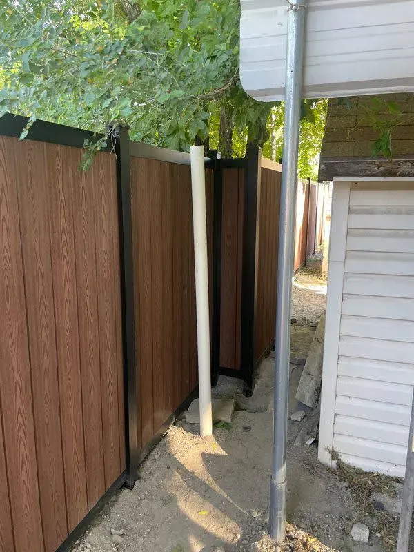 vertical composite fence installed by top rail fence
