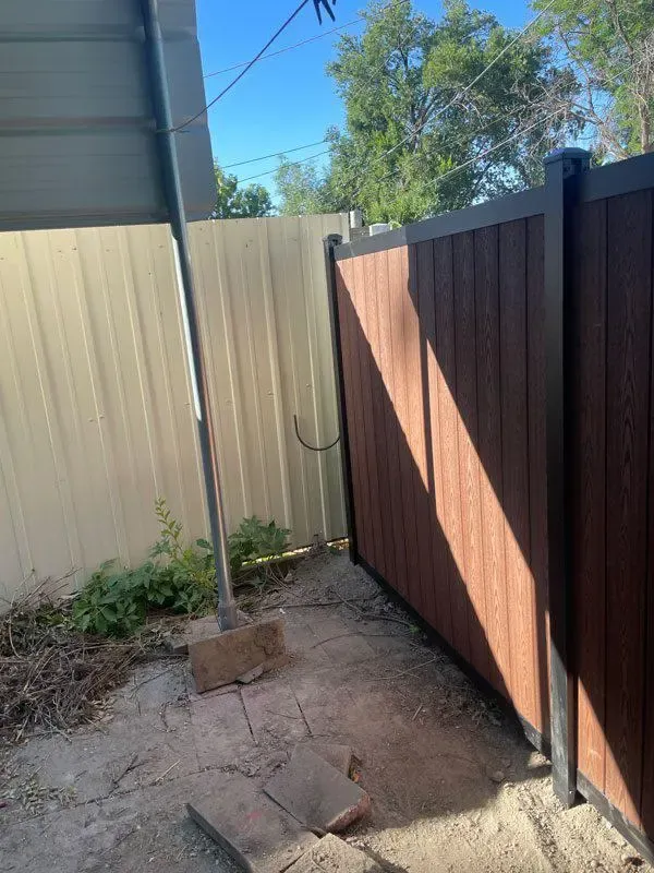 vertical composite fence installed by top rail fence