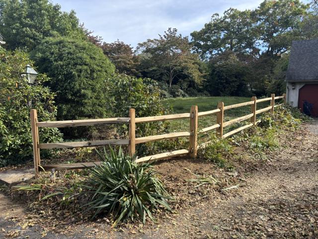 wood split rail fence installed by top rail fence