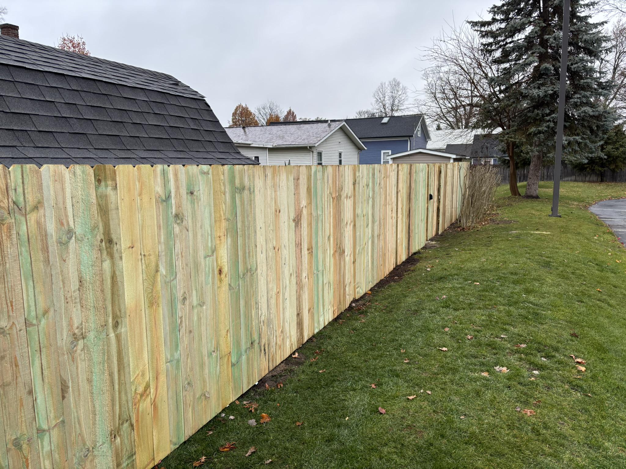 wood privacy fence installed by top rail fence