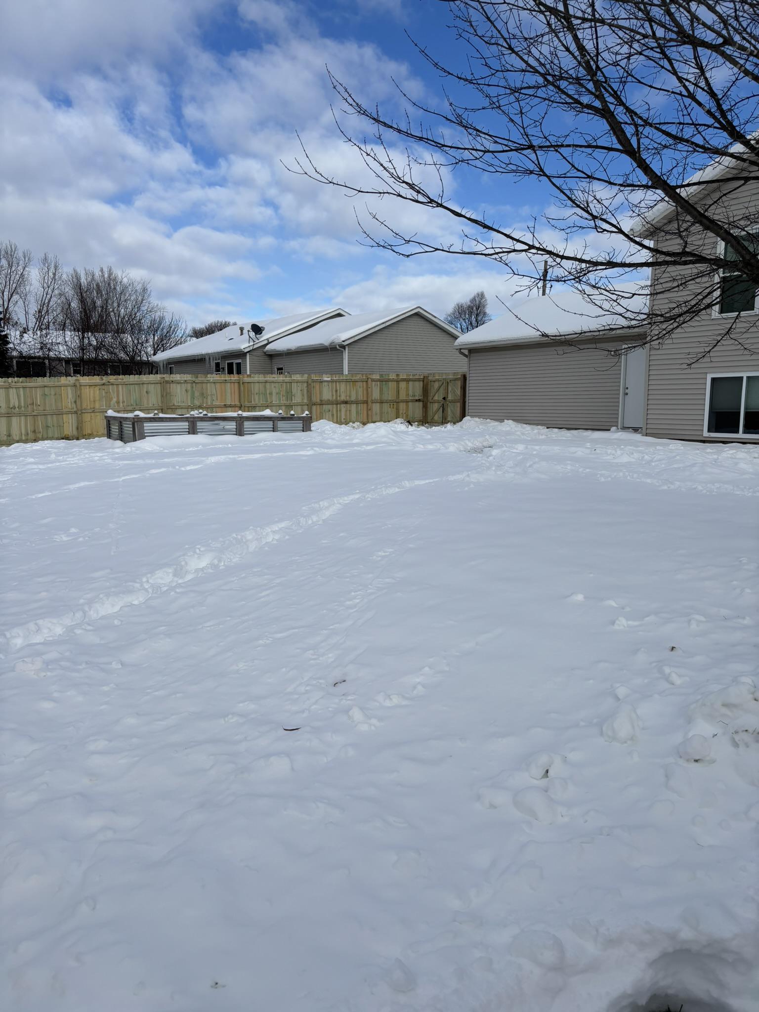 wood privacy fence installed by top rail fence