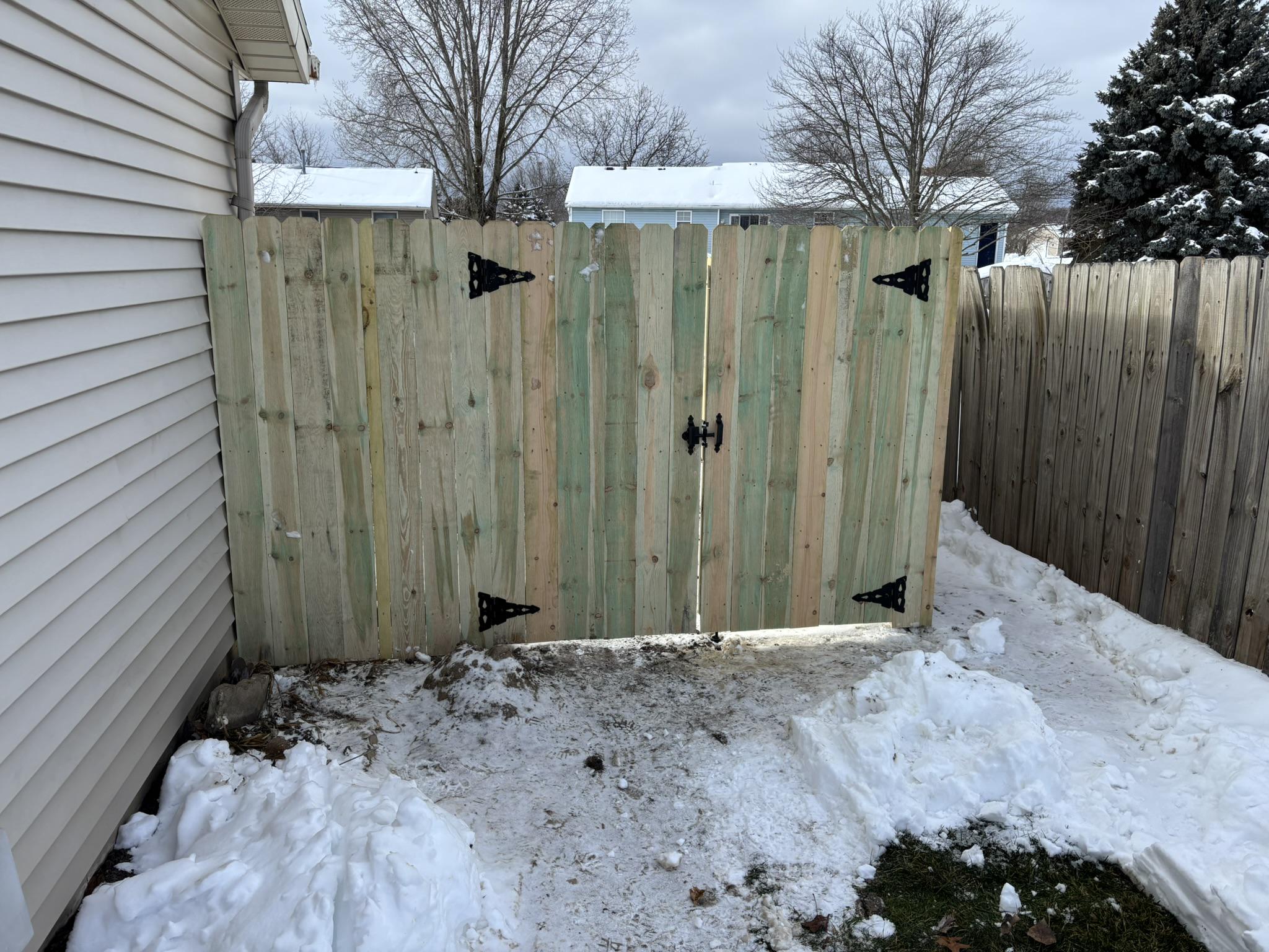 wood privacy fence installed by top rail fence