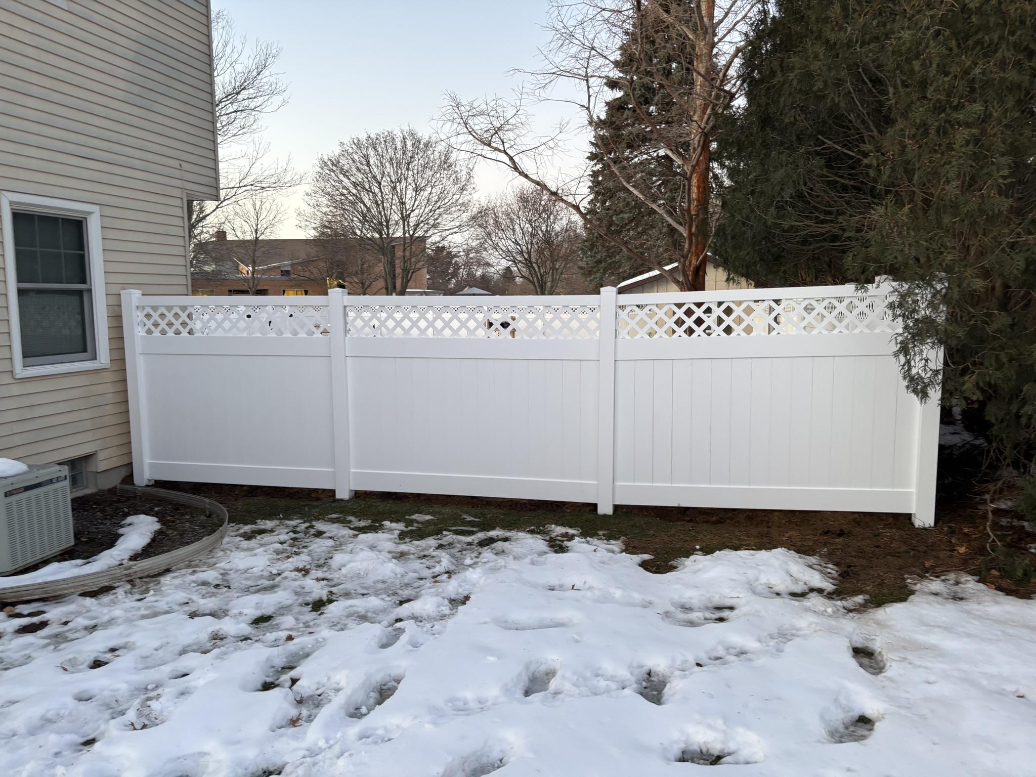  lattice top vinyl fence installed by top rail fence