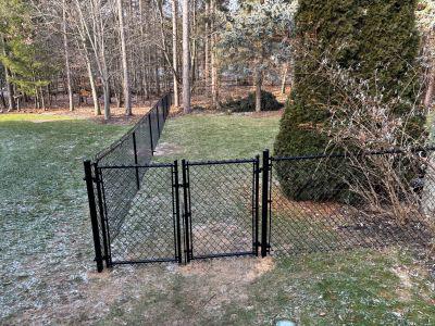 4 feet high black chain link fencing with a double drive gate