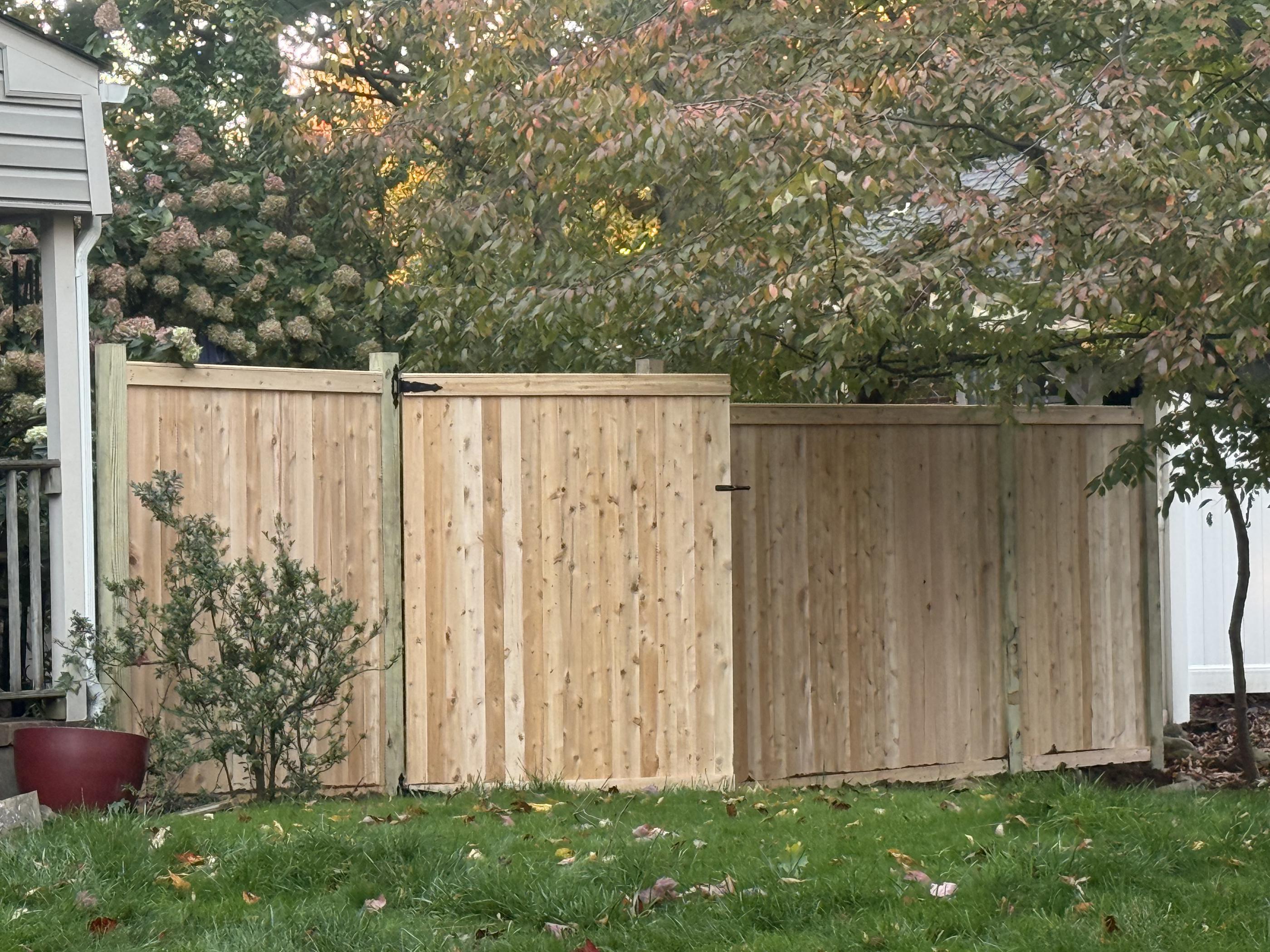 wood cap and trim fence installed by top rail fence