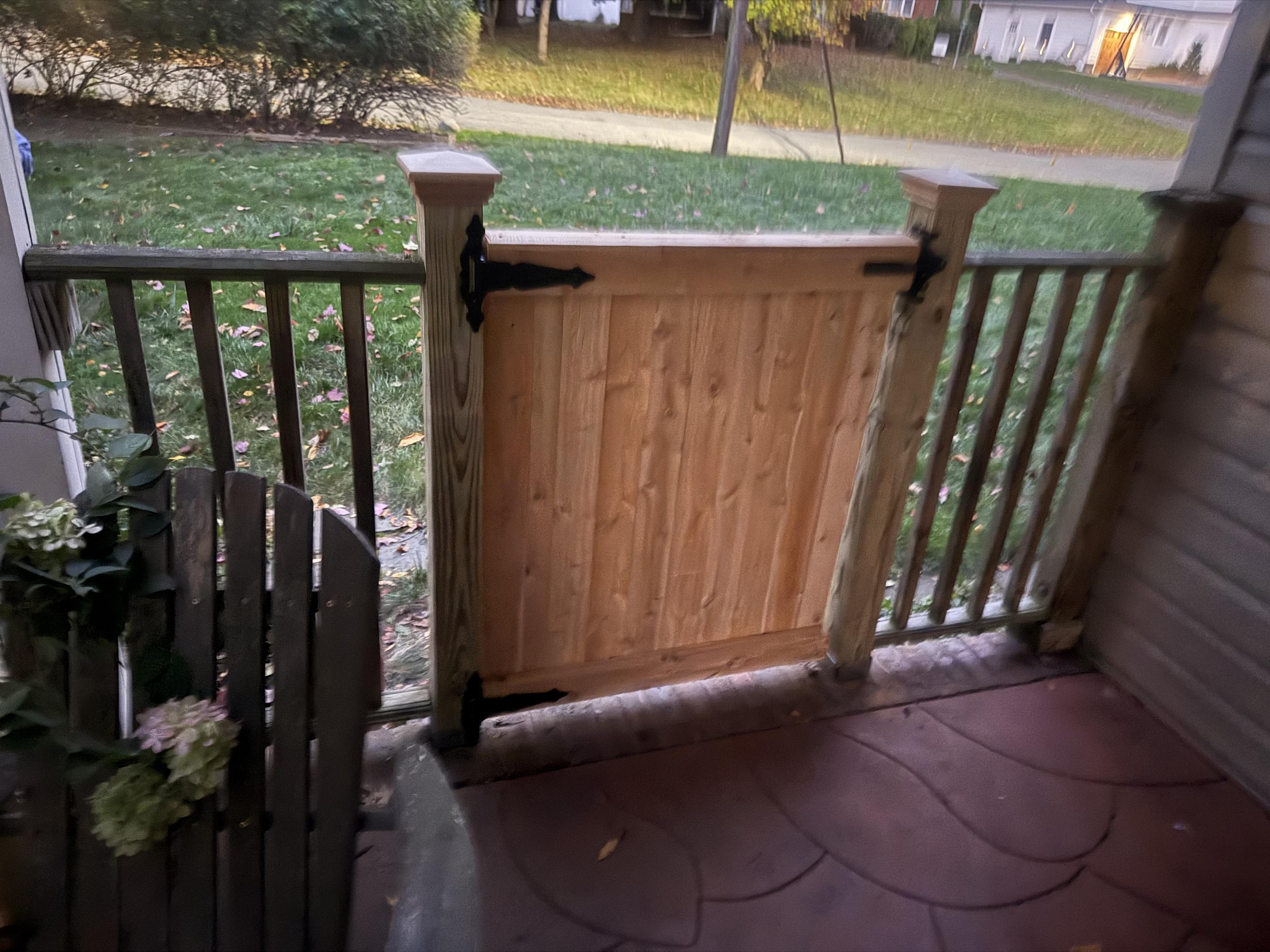 wood swing gate installed by top rail fence