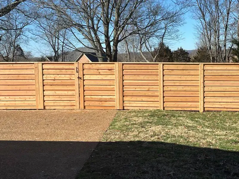 wood horizontal fence installed by top rail fence