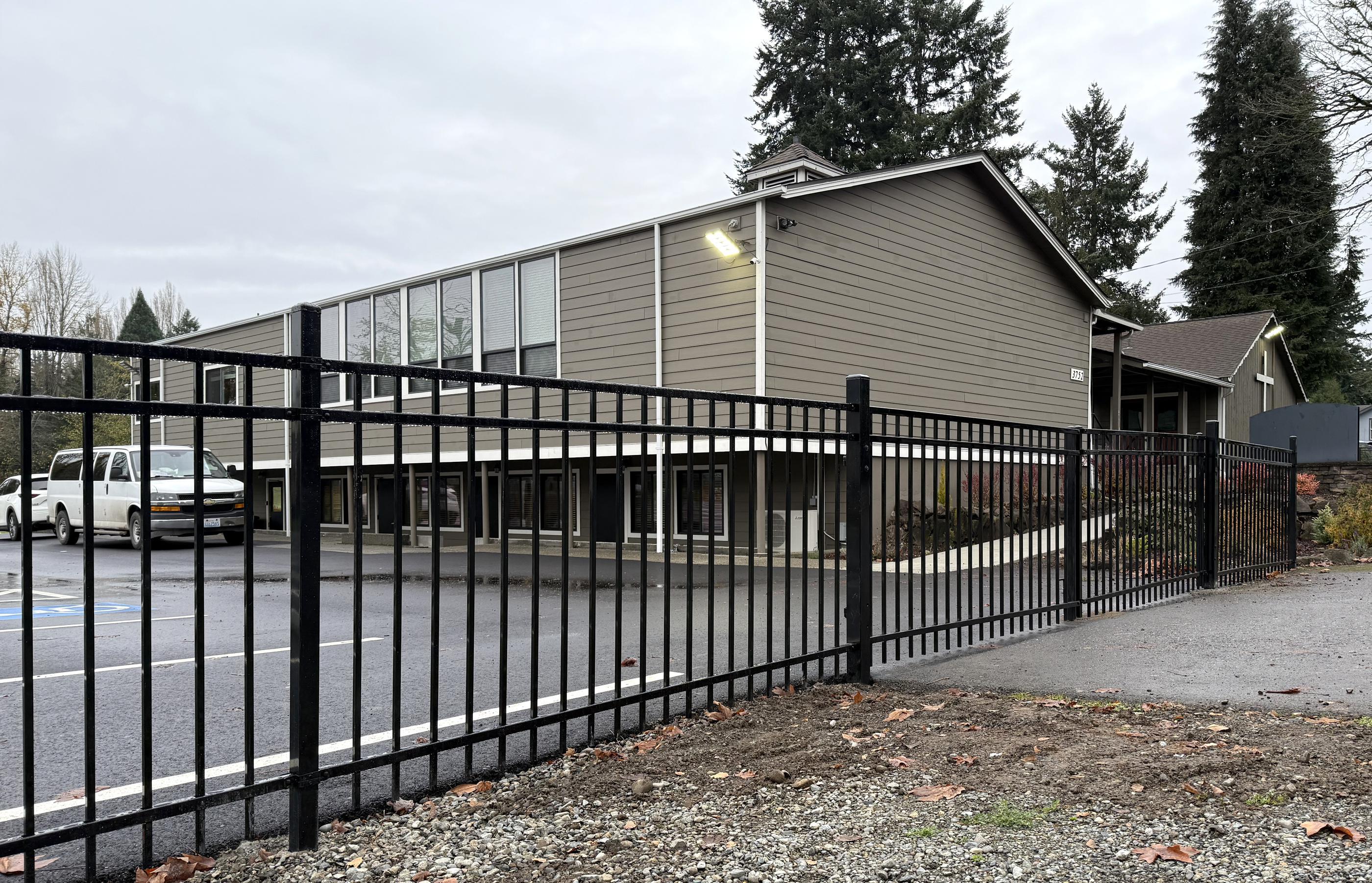ornamental metal horizontal fence installed by top rail fence