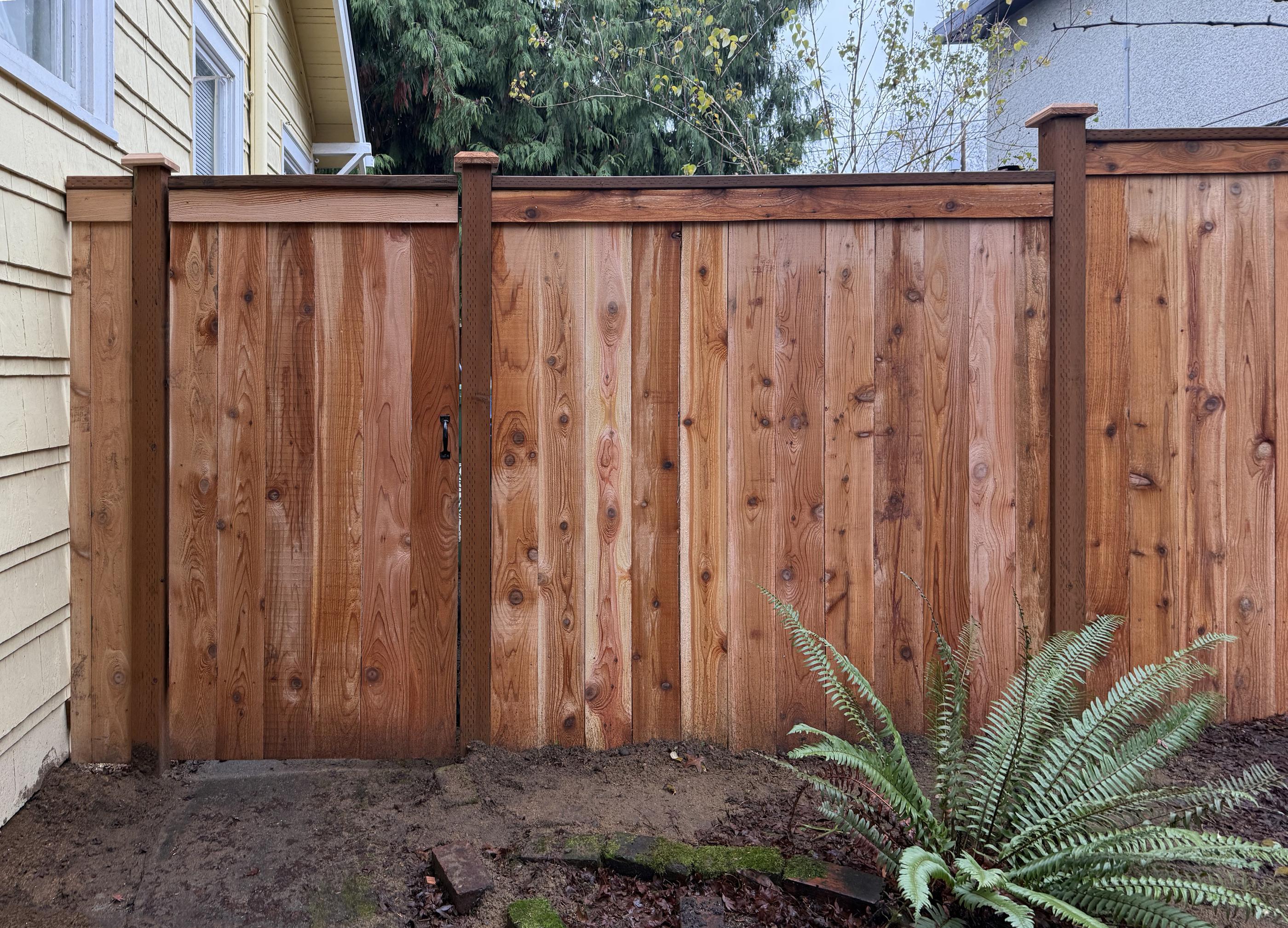 wood cap and trim fence installed by top rail fence