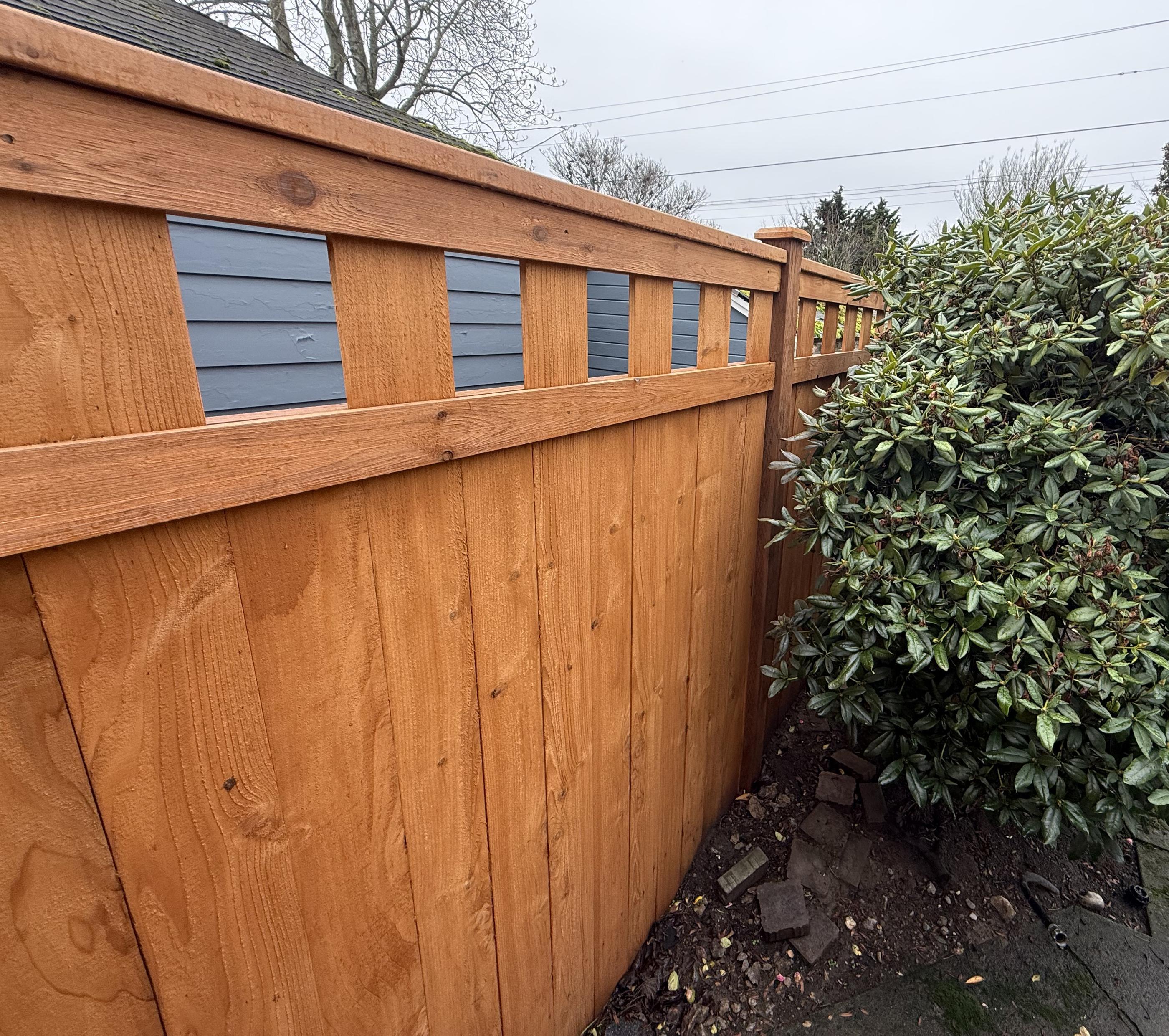 Lattice top fence installed by top rail fence