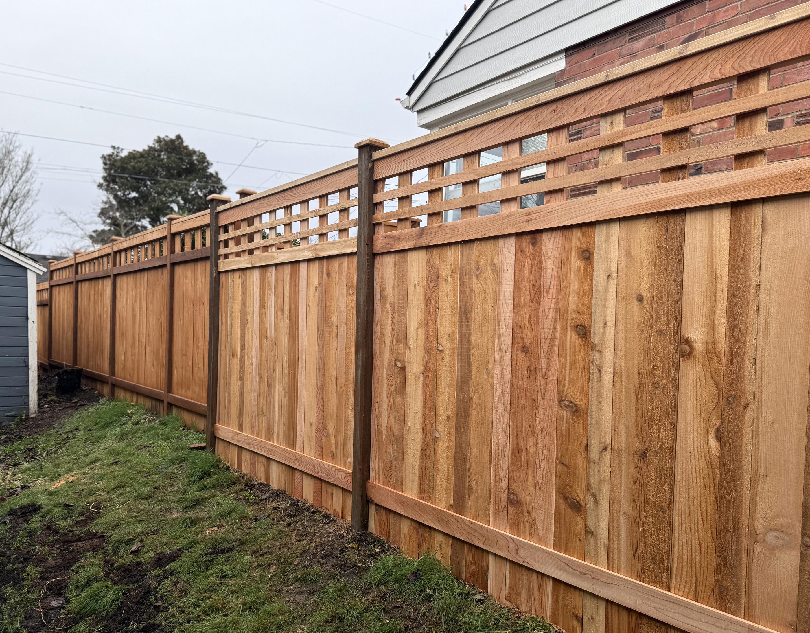 Lattice top fence installed by top rail fence