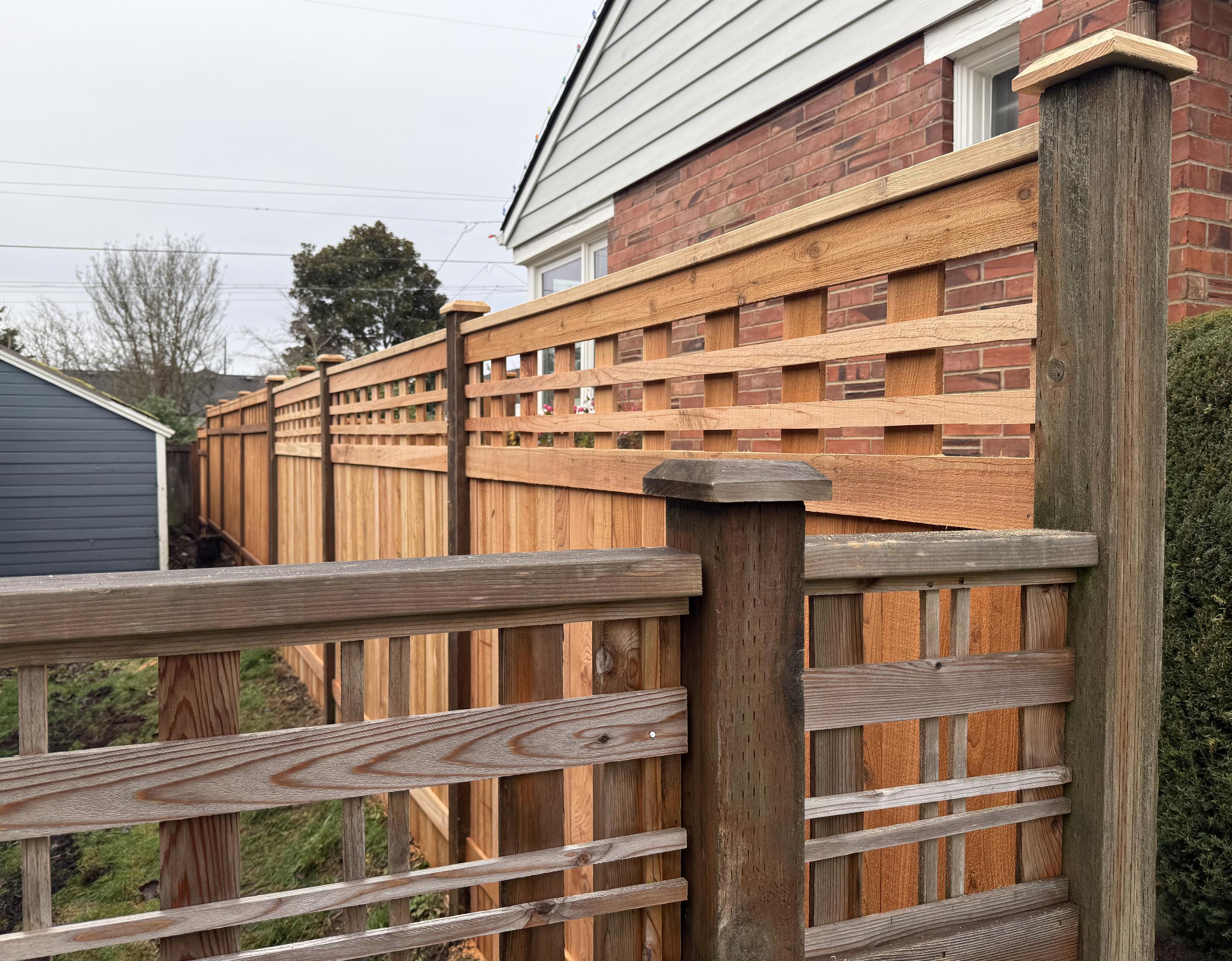 Lattice top fence installed by top rail fence