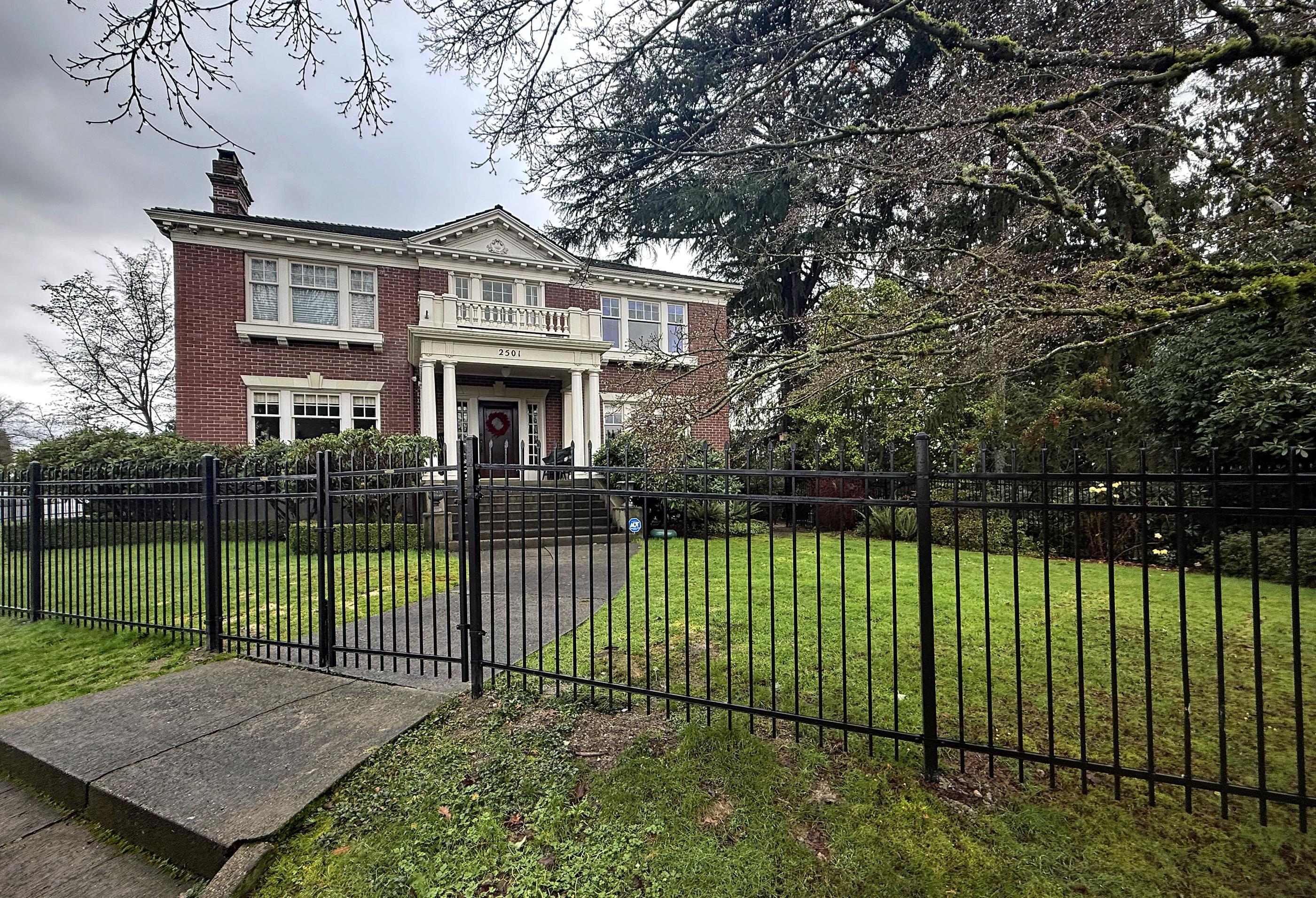 ornamental metal picket fence installed by top rail fence