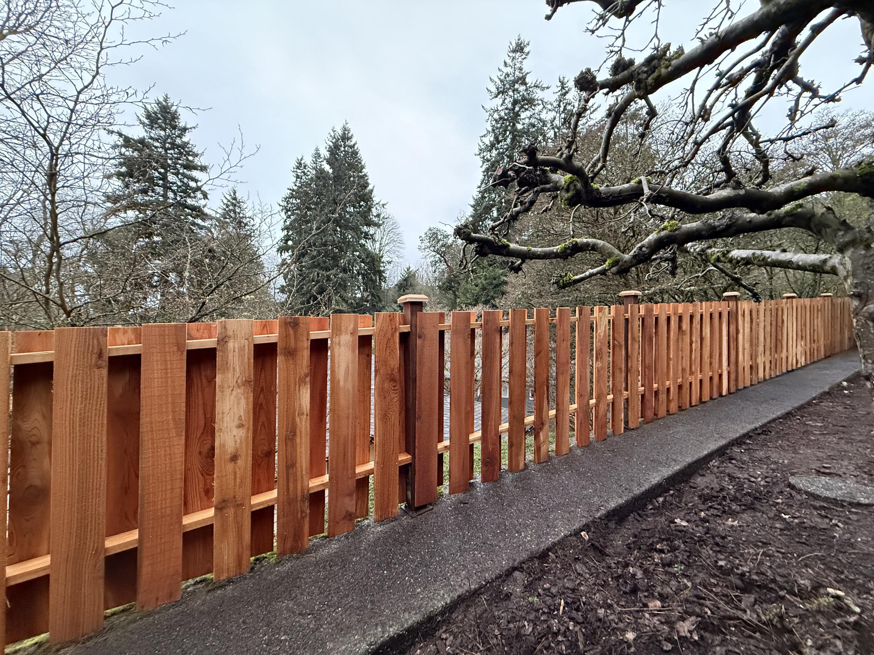 wood fence installed by top rail fence