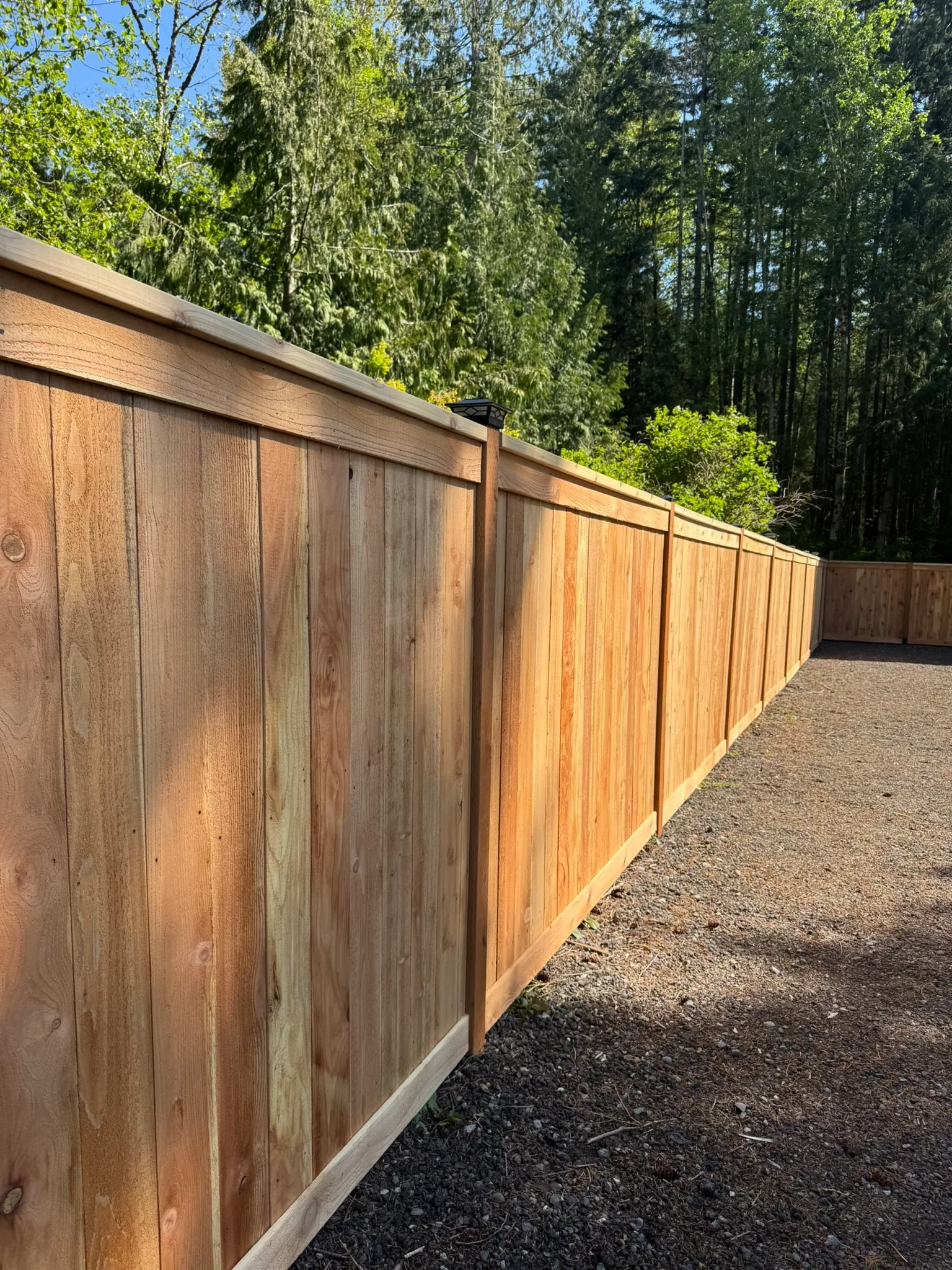 wood cap and trim fence installed by top rail fence