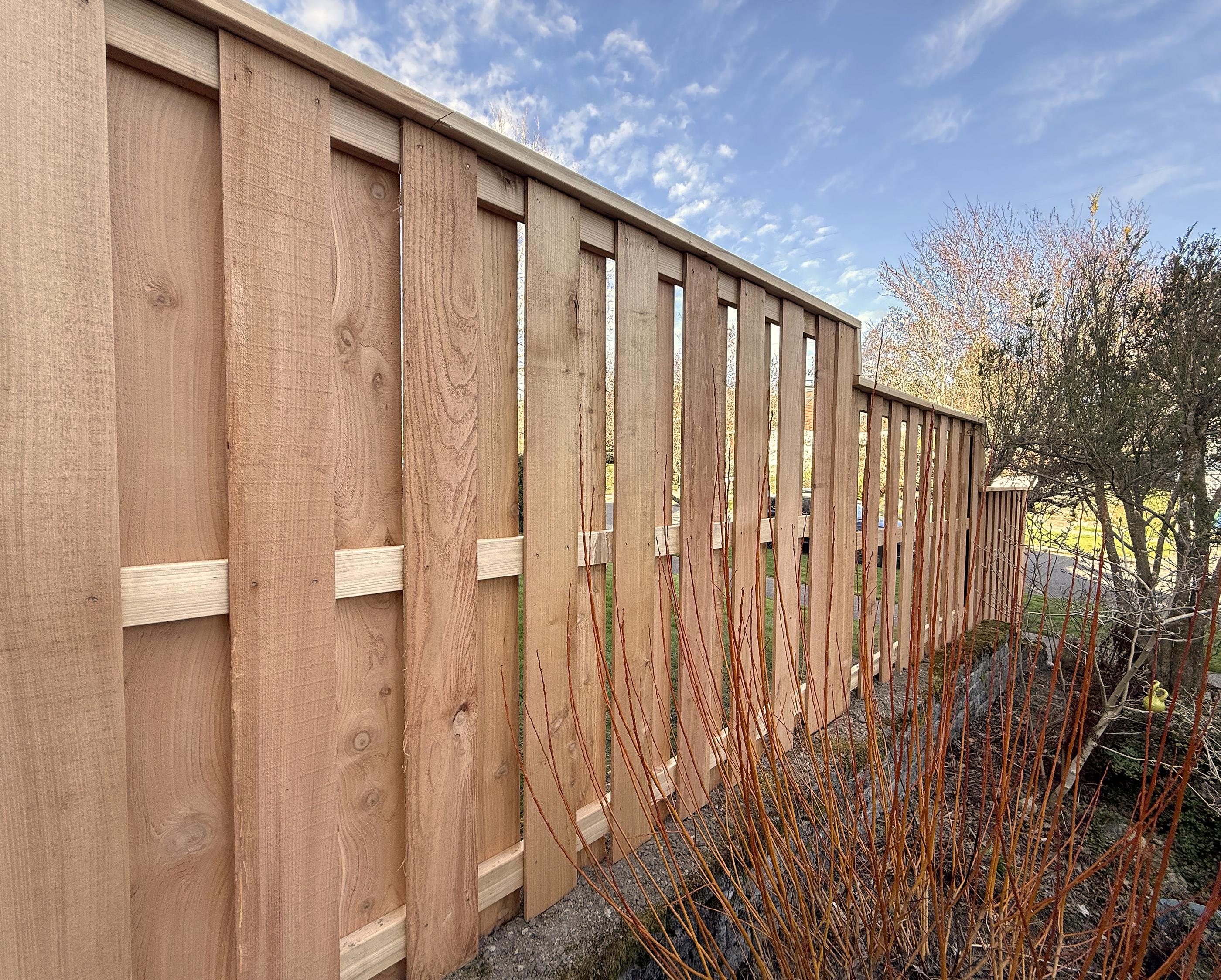 wood shadowbox fence installed by top rail fence
