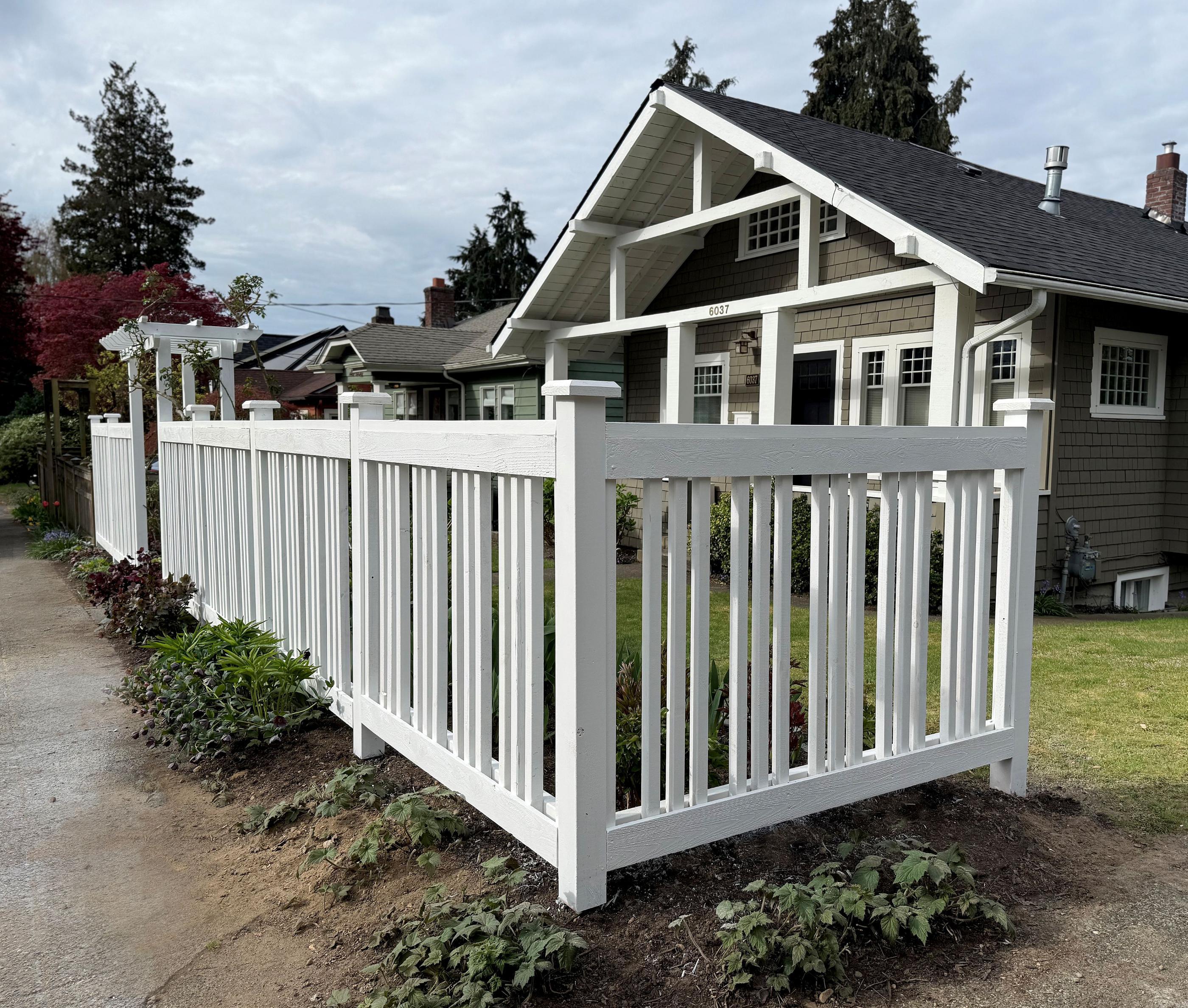 wood spaced board fence installed by top rail fence