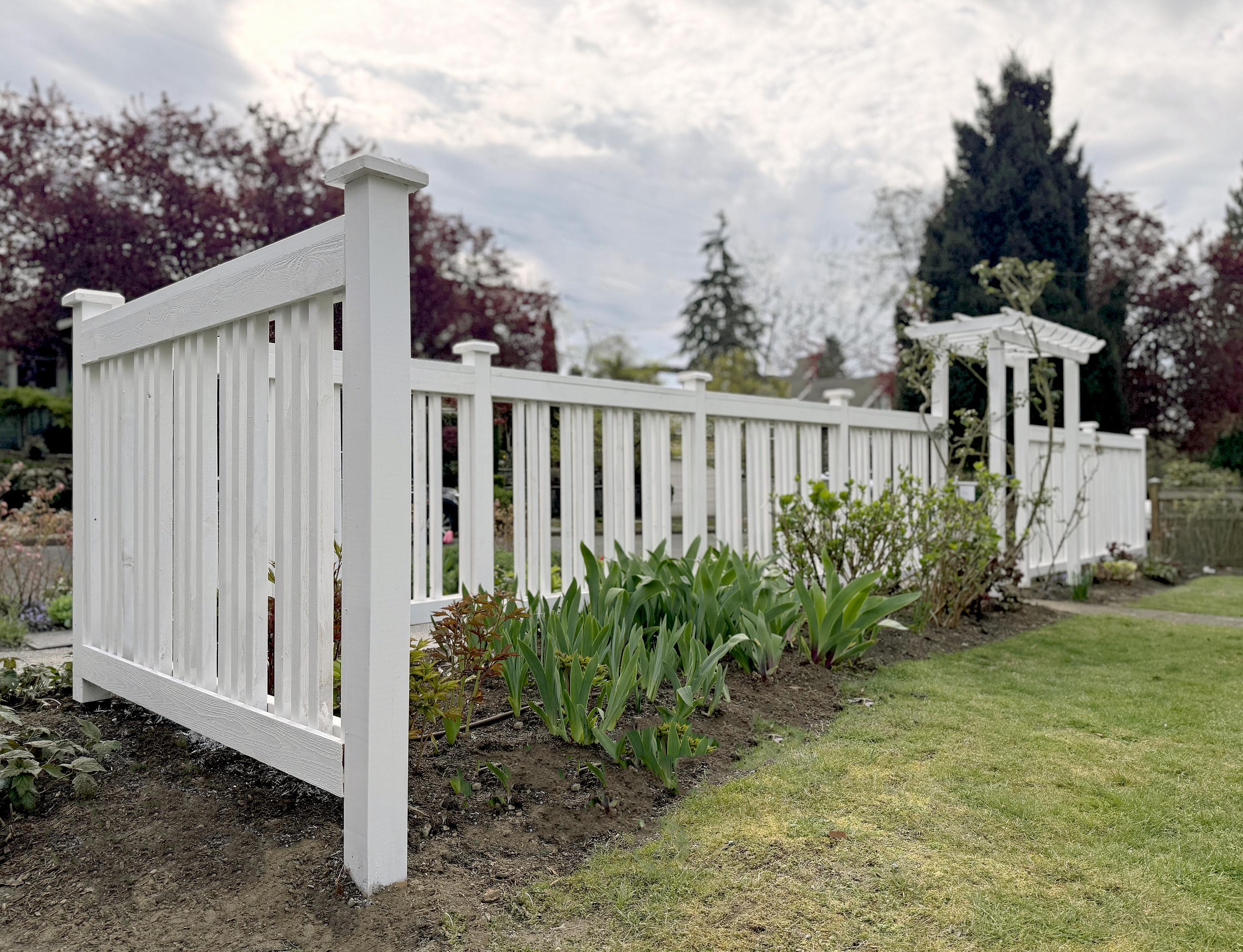 wood spaced board fence installed by top rail fence