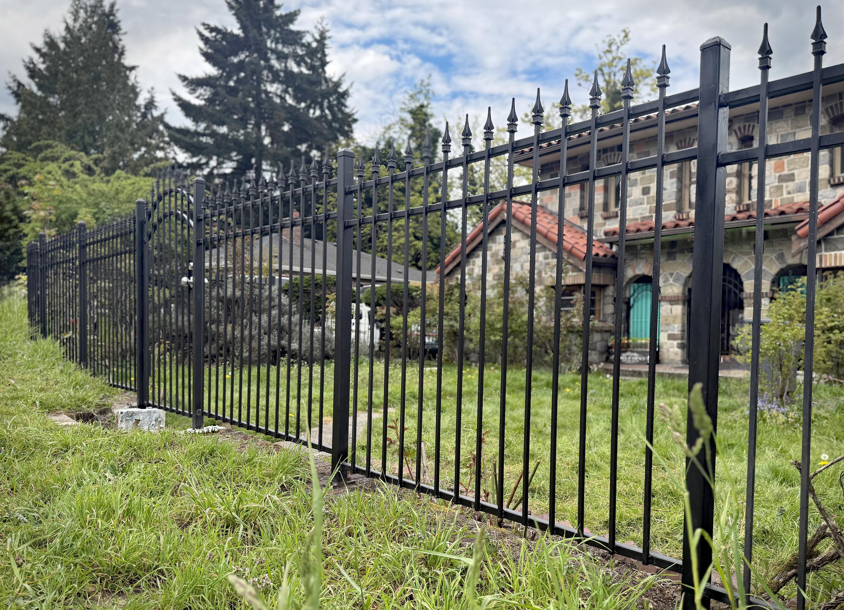 ornamental metal picket fence installed by top rail fence