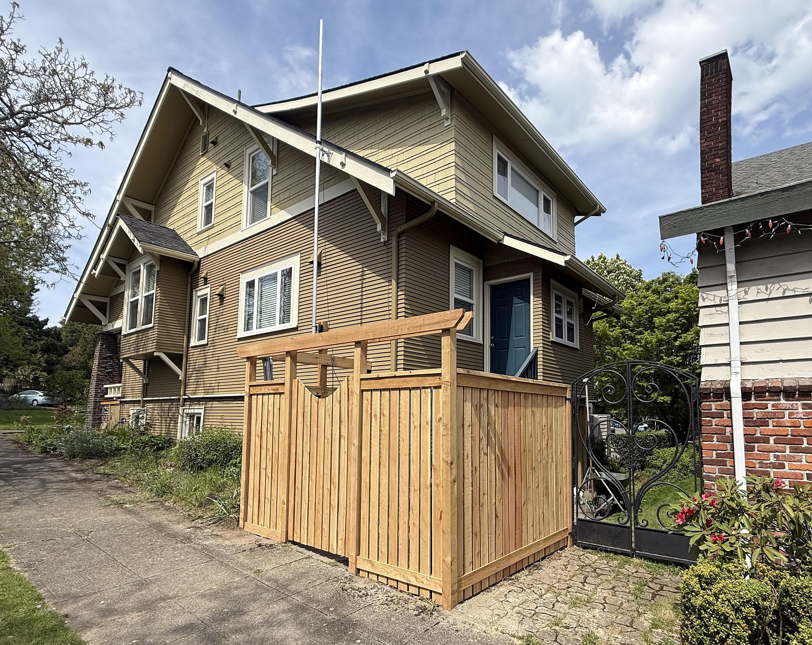 wood entry installed by top rail fence