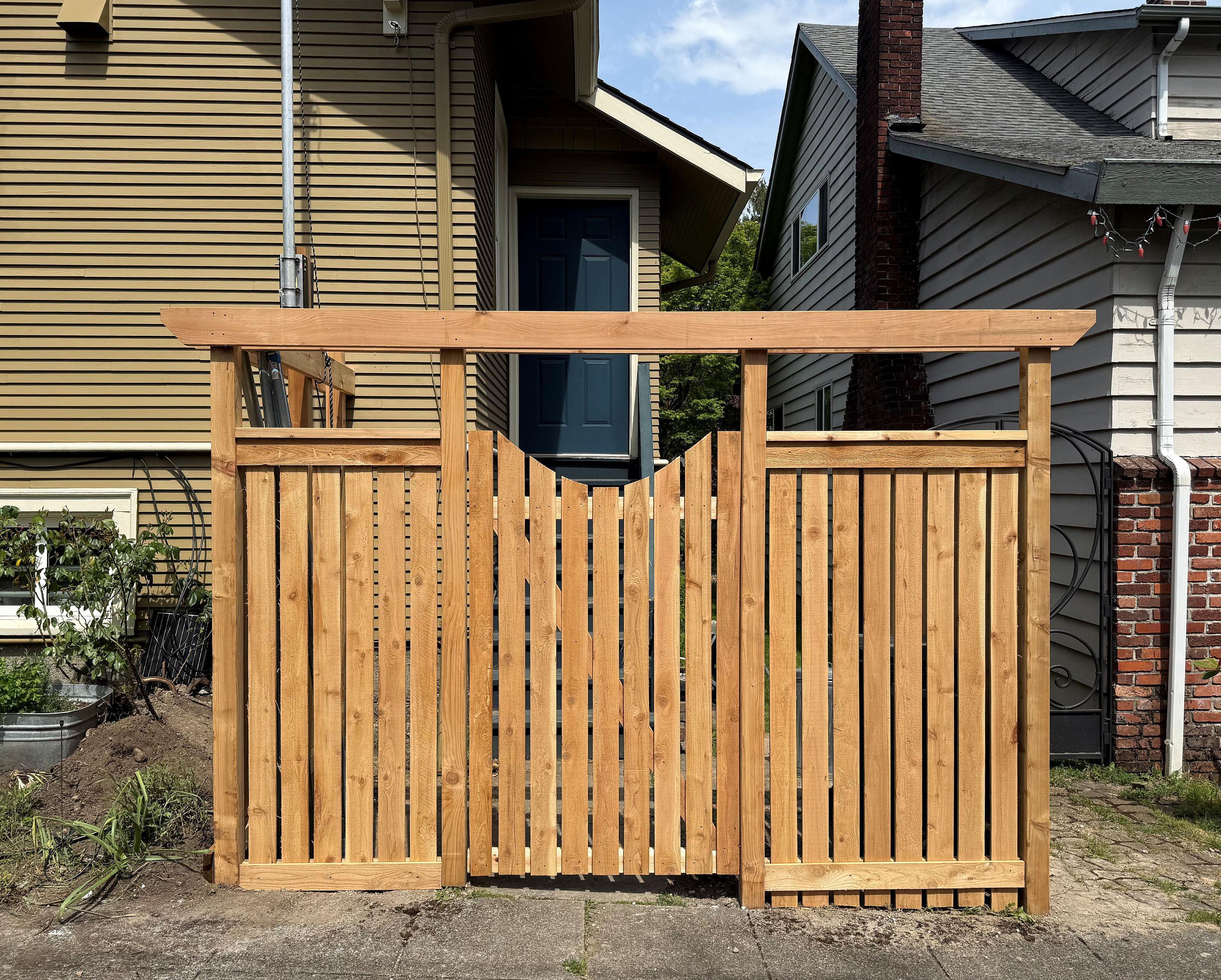 wood entry installed by top rail fence