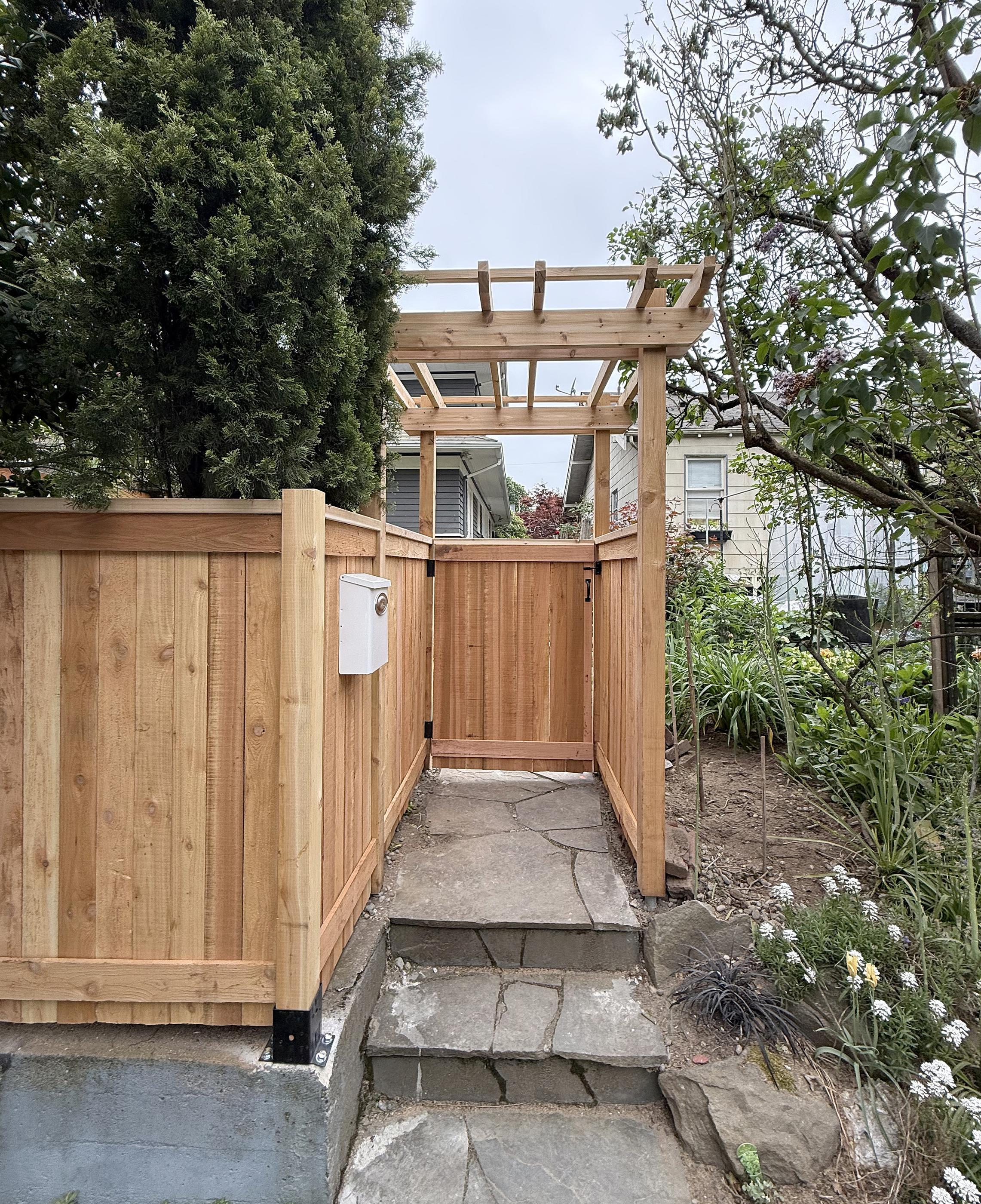 wood entry installed by top rail fence