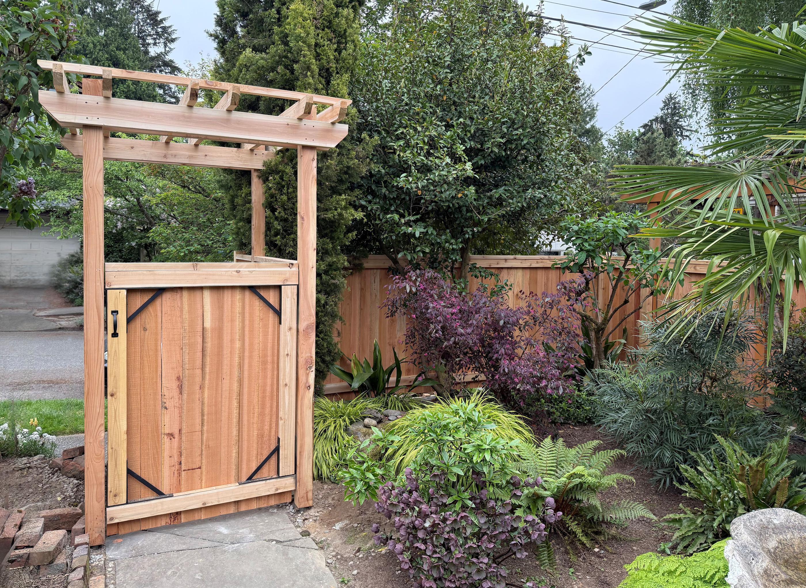 wood entry installed by top rail fence