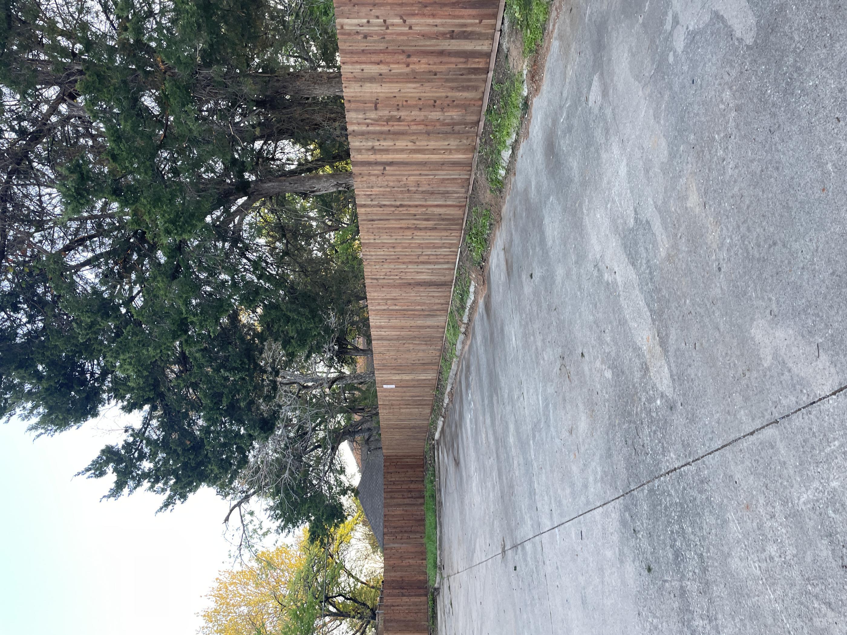 wood privacy fence installed by top rail fence